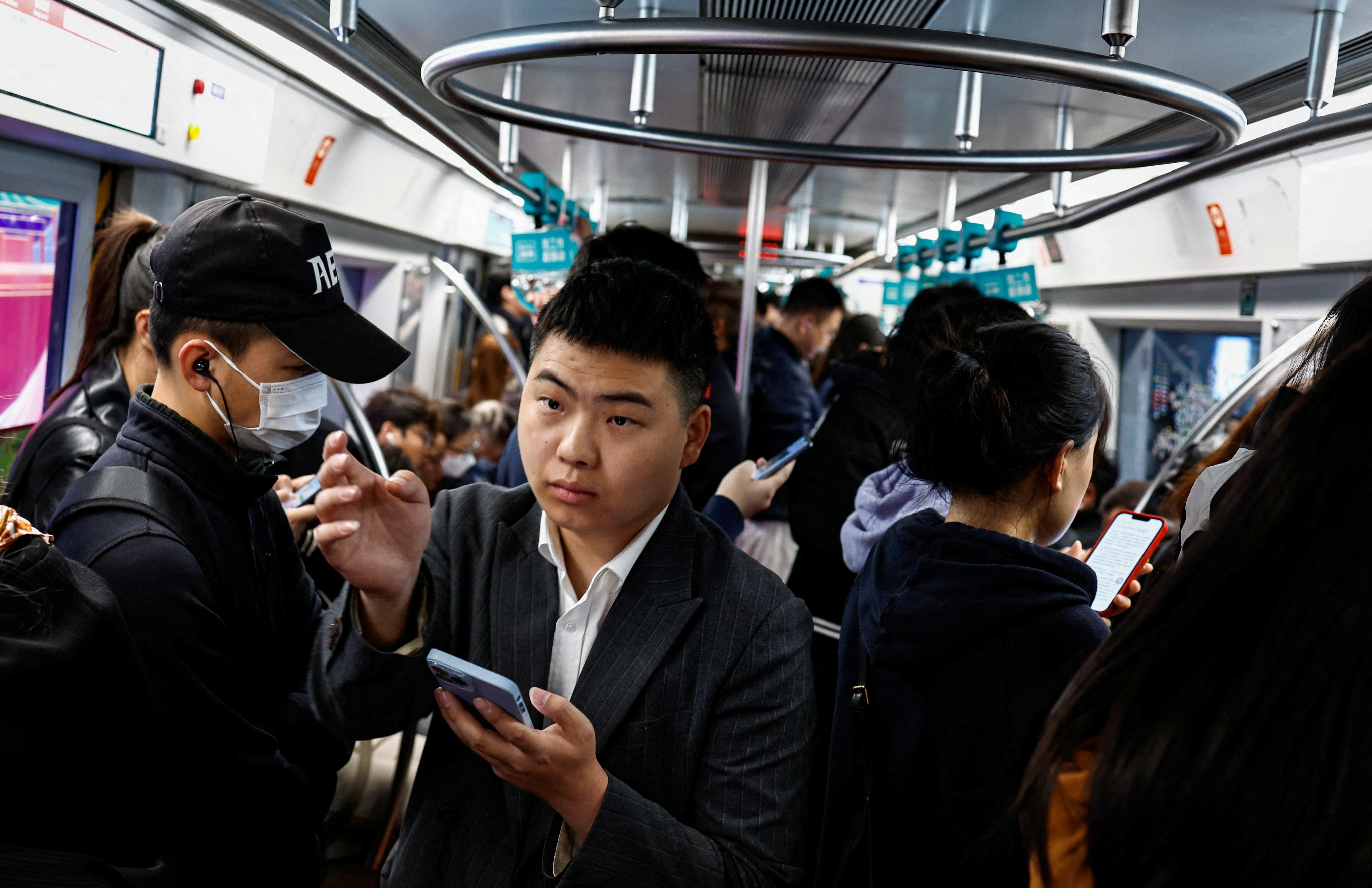 People ride a subway train during morning rush hour in Beijing on April 11. Despite some positive signs of better things to come, consumers, investors and entrepreneurs still lack confidence in the economic outlook. Photo: Reuters