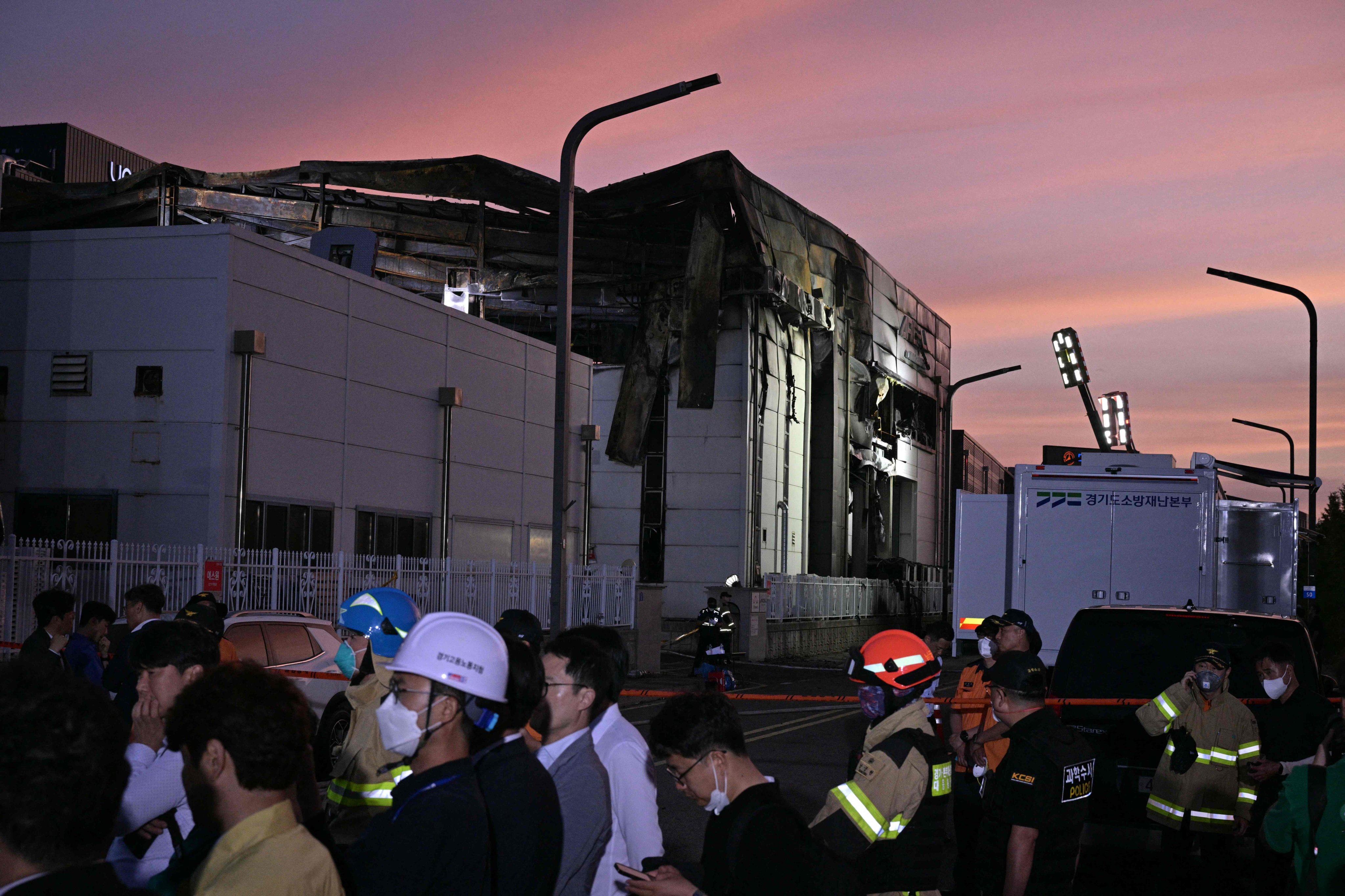 The fire-damaged lithium battery factory owned by South Korean battery maker Aricell is seen at dusk in Hwaseong on Monday. Photo: AFP
