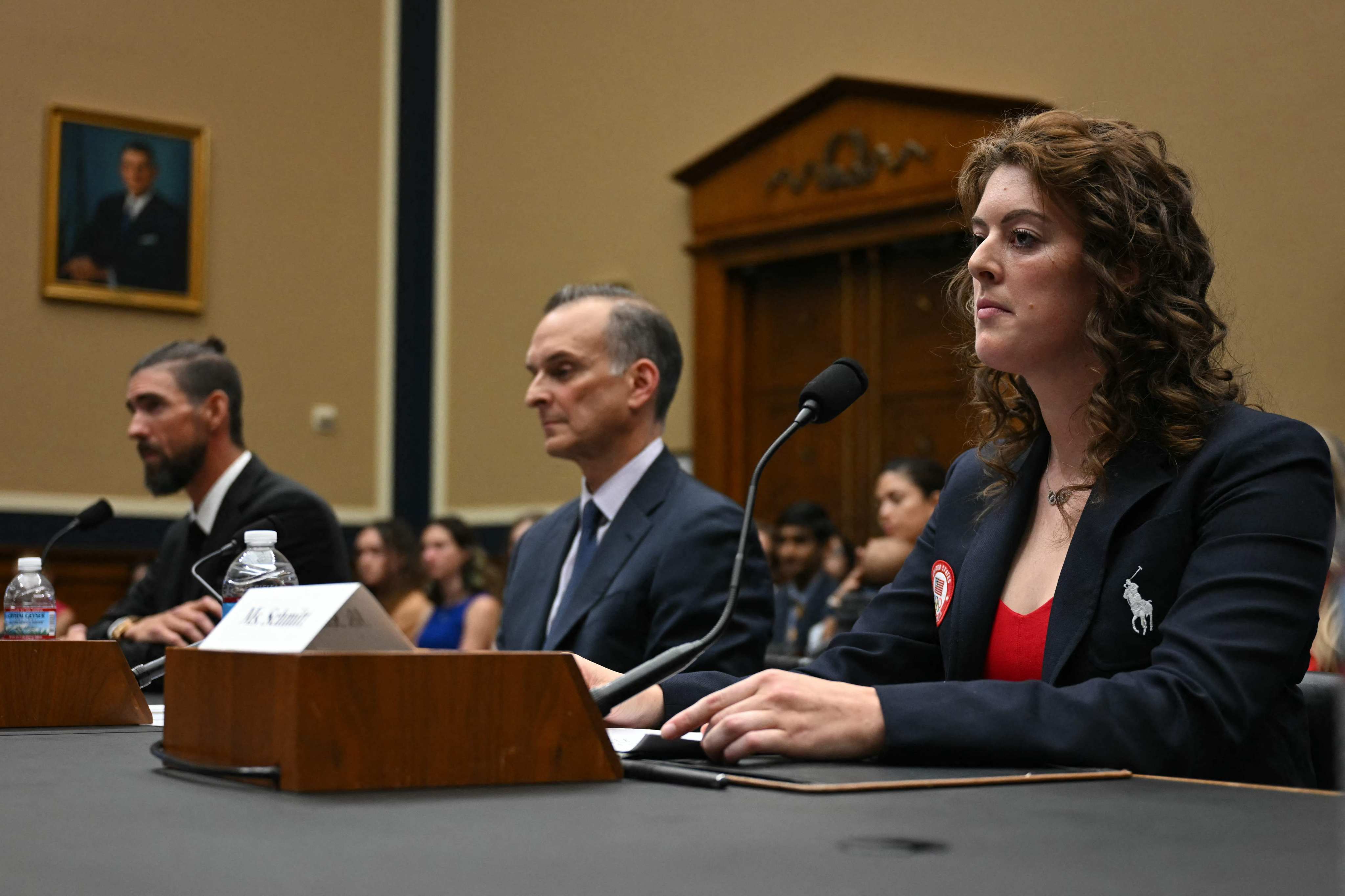 Former US Olympians Michael Phelps (left) and Allison Schmitt flanking US Anti-Doping Agency CEO Travis Tygart as they testify before a US Congress subcommittee hearing on anti-doping measures ahead of the 2024 Paris Olympics. Photo: AFP