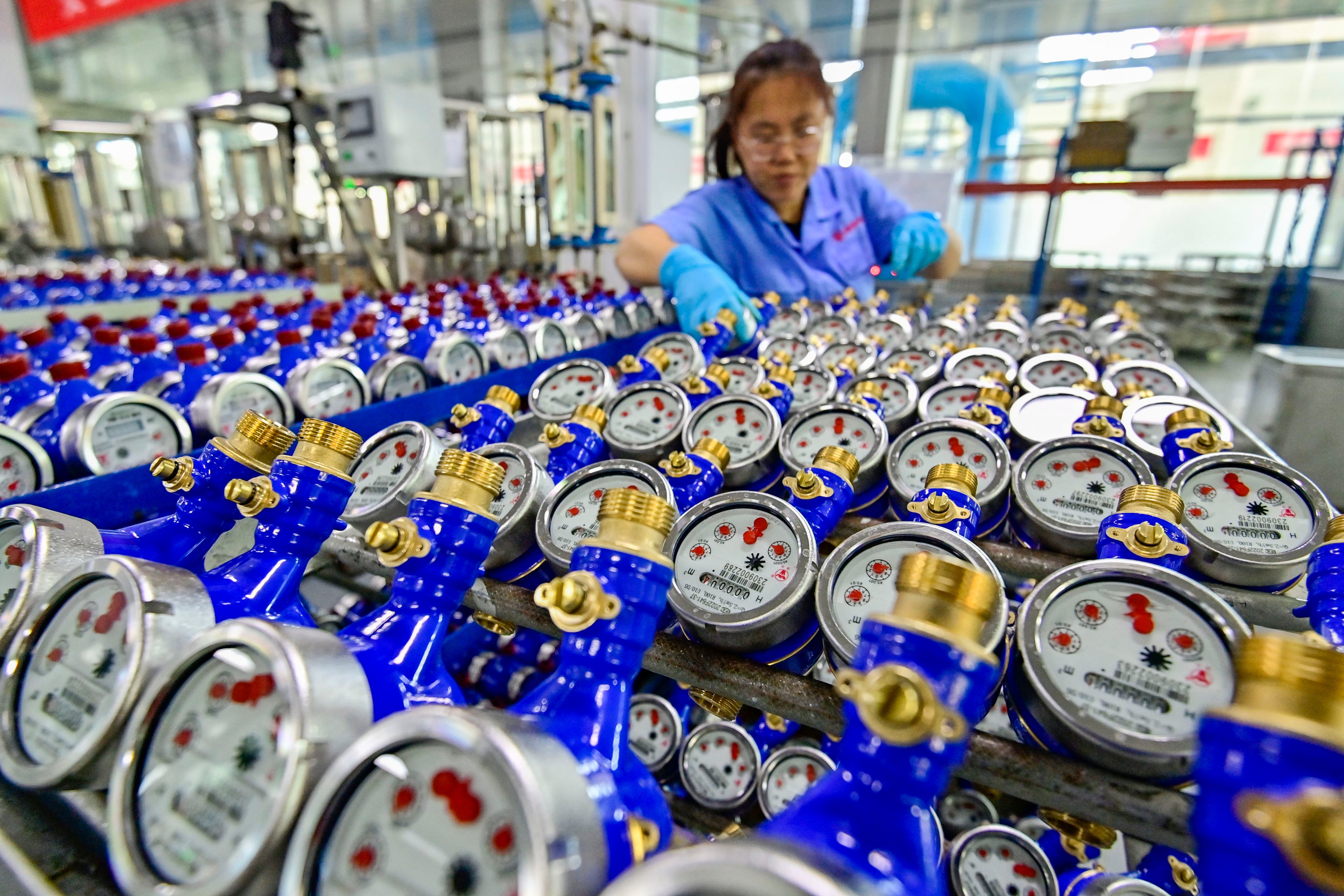 A worker arranges products that are about to roll off the production line at a smart water meter manufacturer in Qingzhou, Shandong province, China, September 27, 2023. Profit for Chinese industrial companies increased 0.7 per cent from a year earlier in May, decelerating from a 4 per cent gain in the previous month, the statistics bureau said on Thursday. Photo: Getty Images