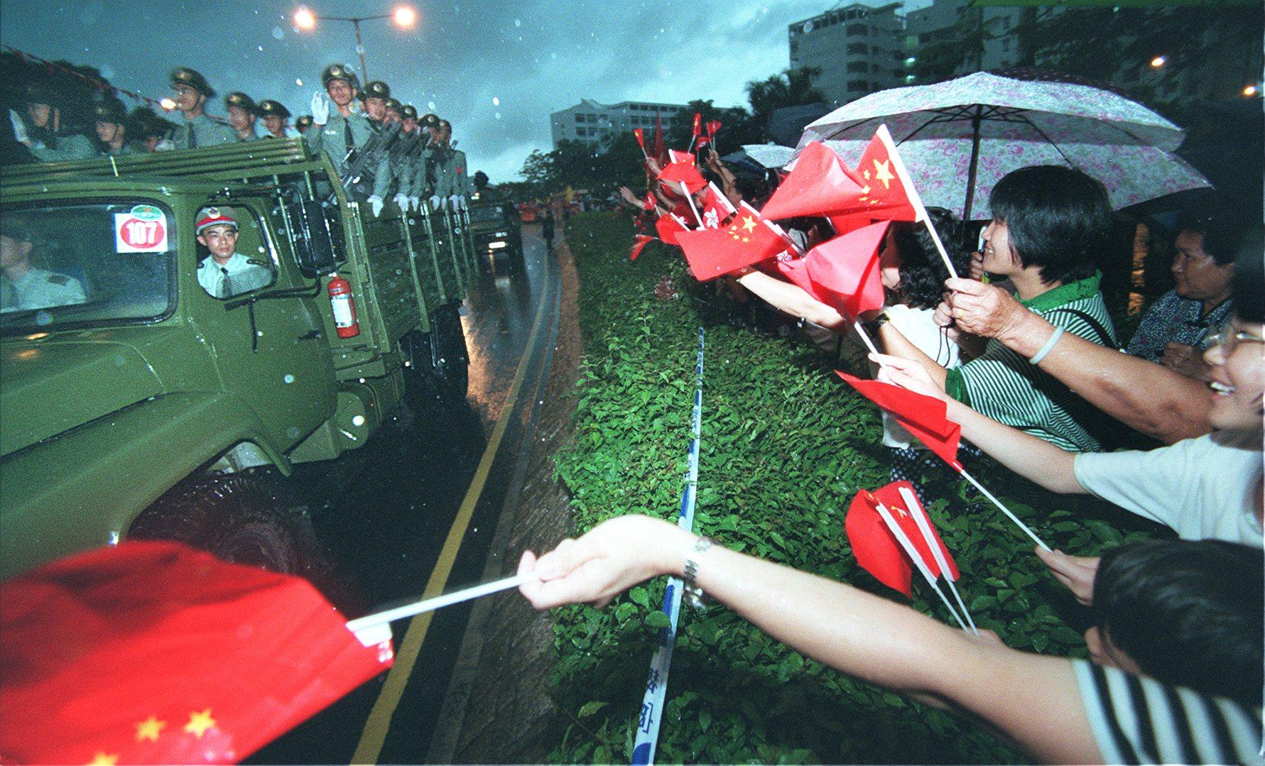 Residents of Sheung Shui greet People’s Liberation Army soldiers who entered Hong Kong on July 1, 1997. Photo: Oliver Tsang