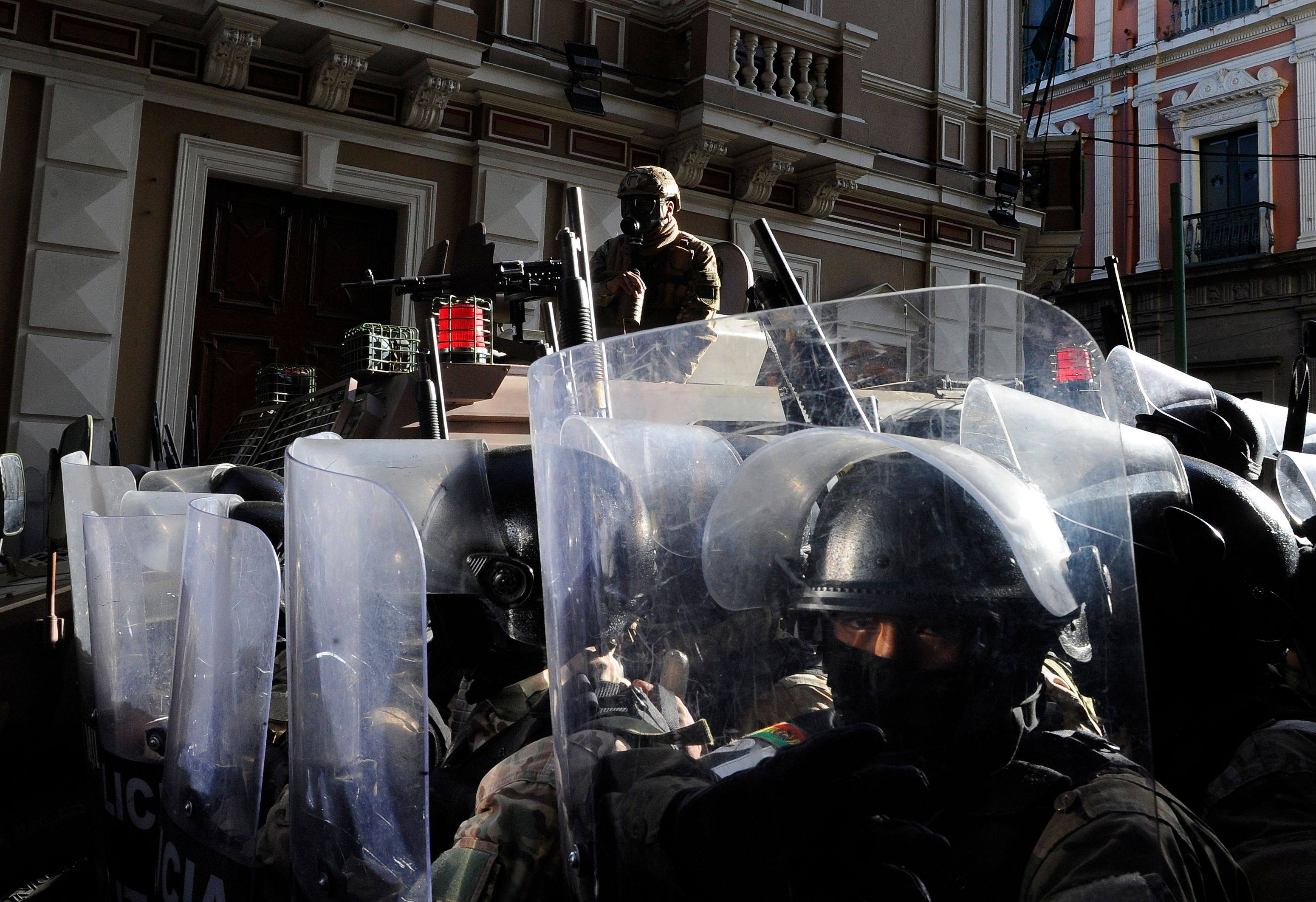 Military police stand guard outside Quemado Palace at Plaza Murillo in La Paz. Photo: AFP