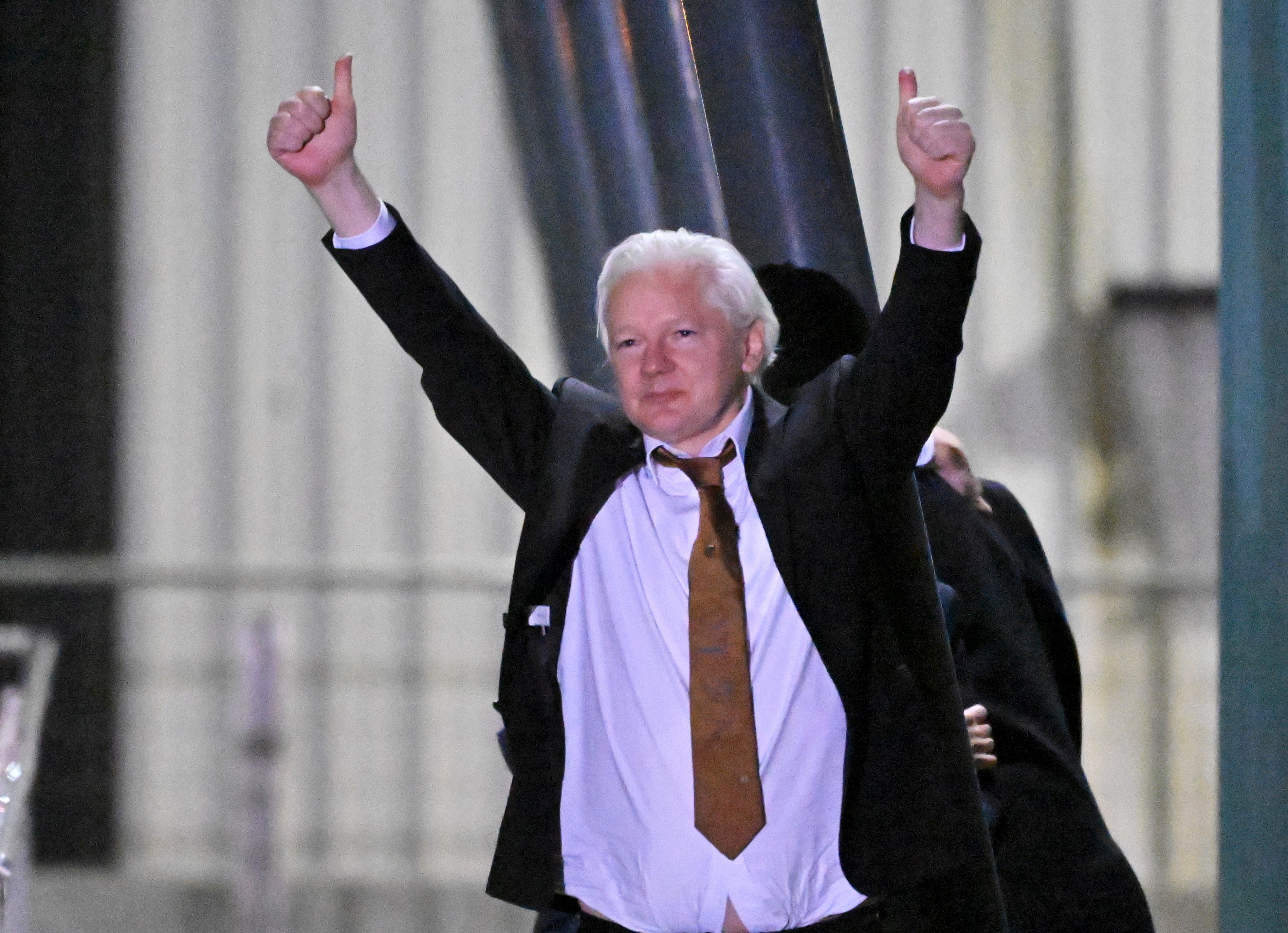 WikiLeaks founder Julian Assange waves at supporters after arriving at Canberra Airport, in Canberra, Australia, on Wednesday. Photo: EPA-EFE