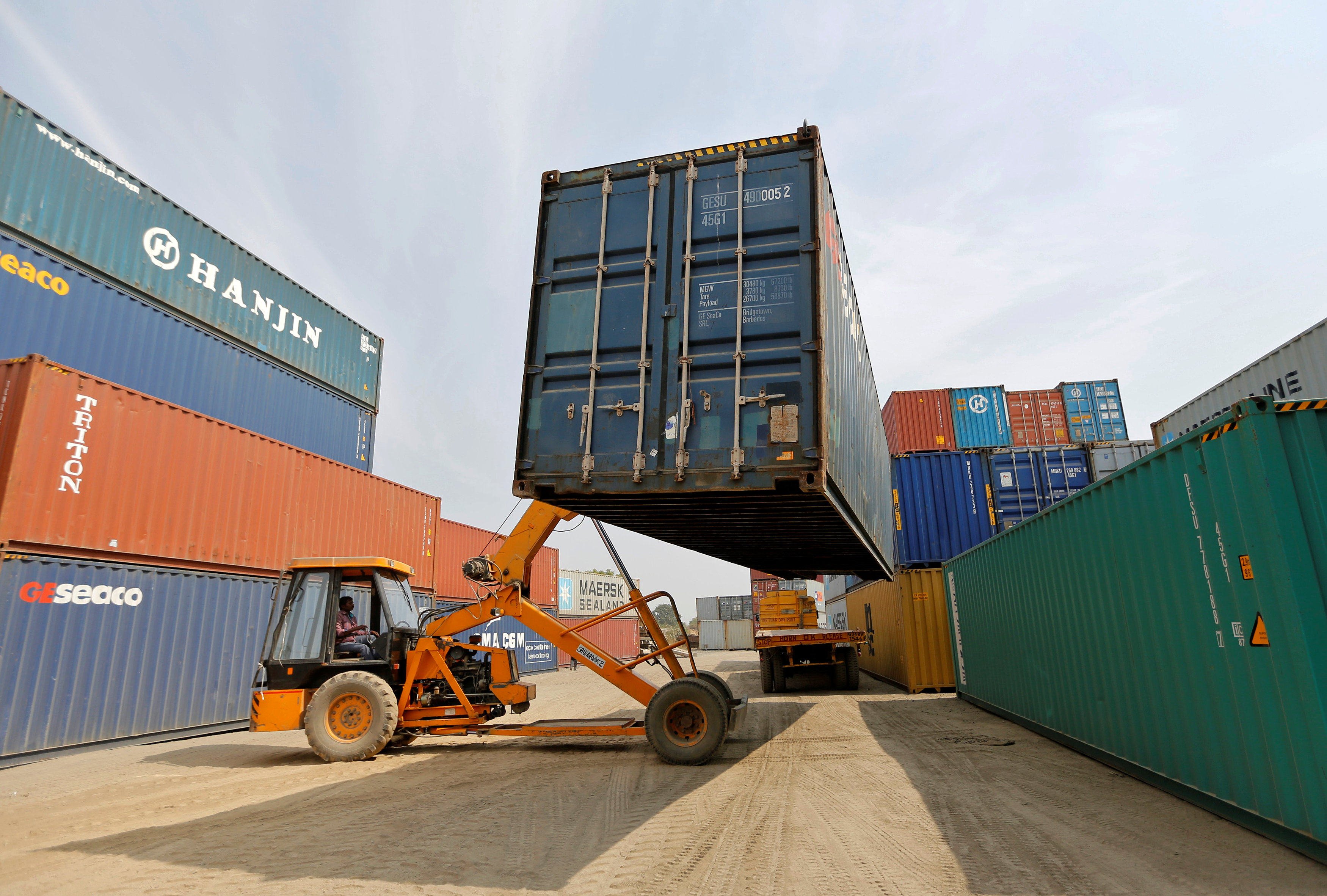 A crane moves containers at a “dry port” in India’s Gujarat state. The new deepwater port at Vadhavan will be one of the world’s largest once completed. Photo: Reuters