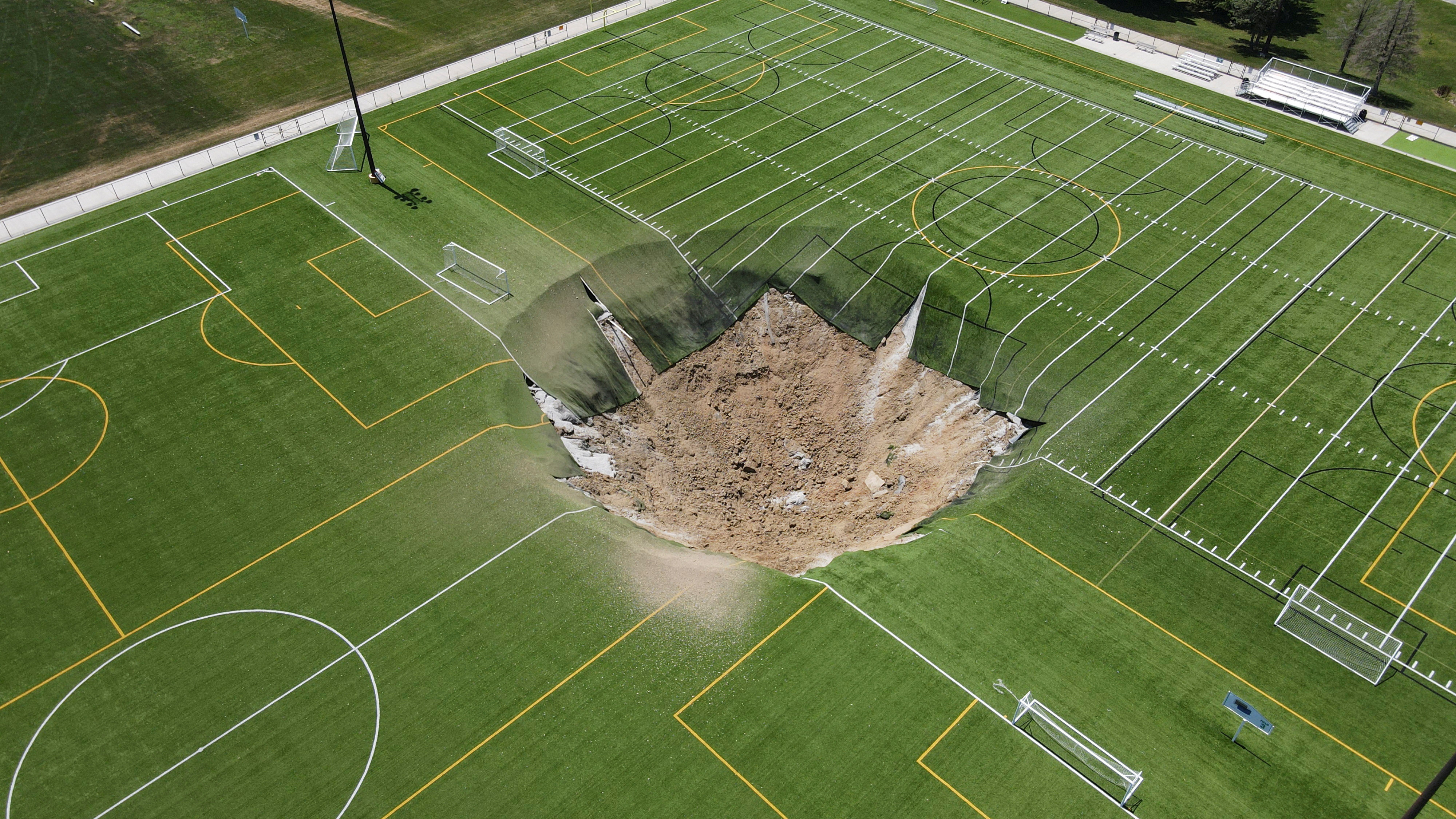 A drone view shows a sinkhole that formed on a soccer field at Gordon Moore Park in Alton, Illinois, on Thursday. Photo: Reuters 