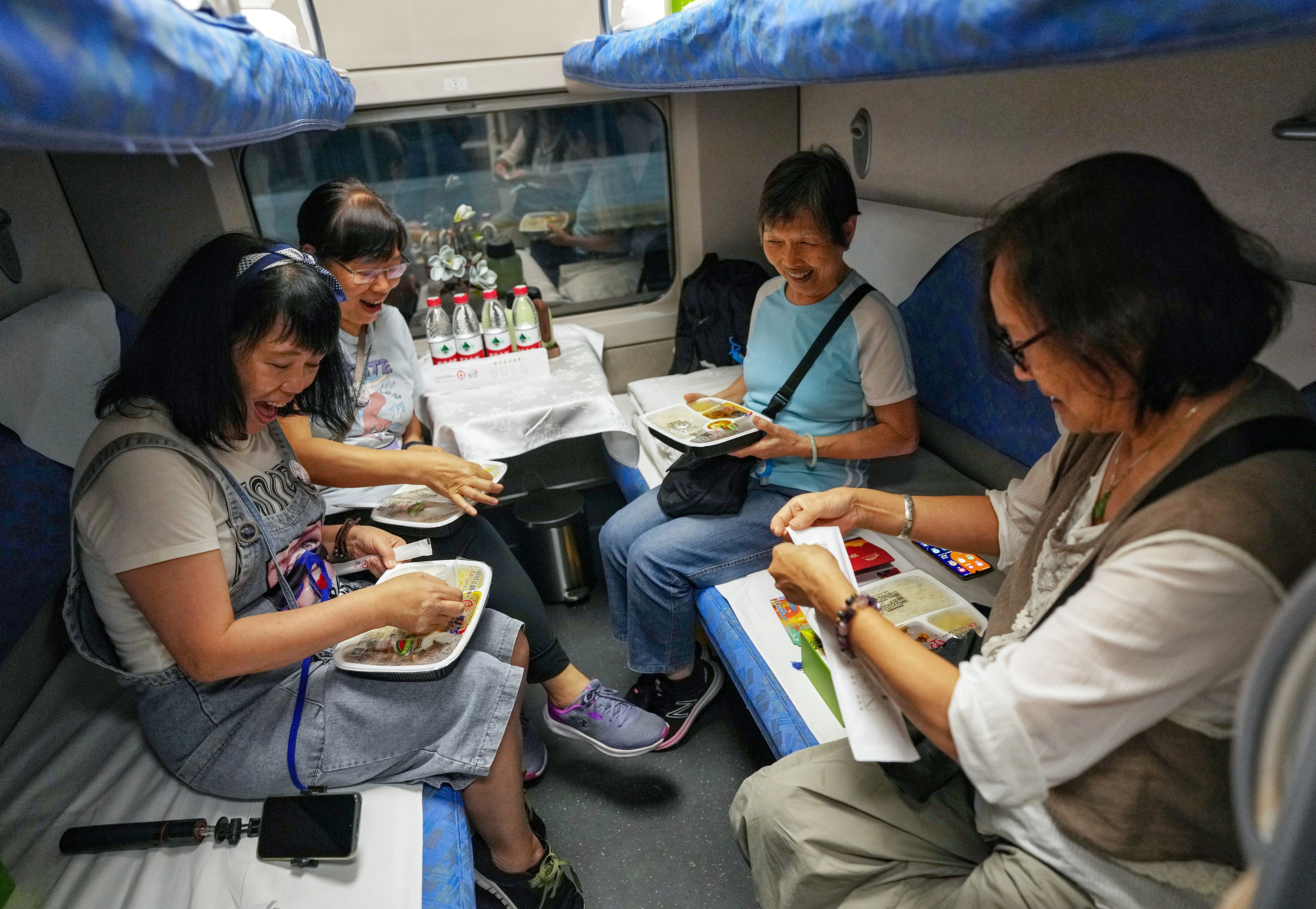 Passengers tuck in as a new high-speed sleeper train departs from West Kowloon station for Beijing on June 15. Photo: Elson Li