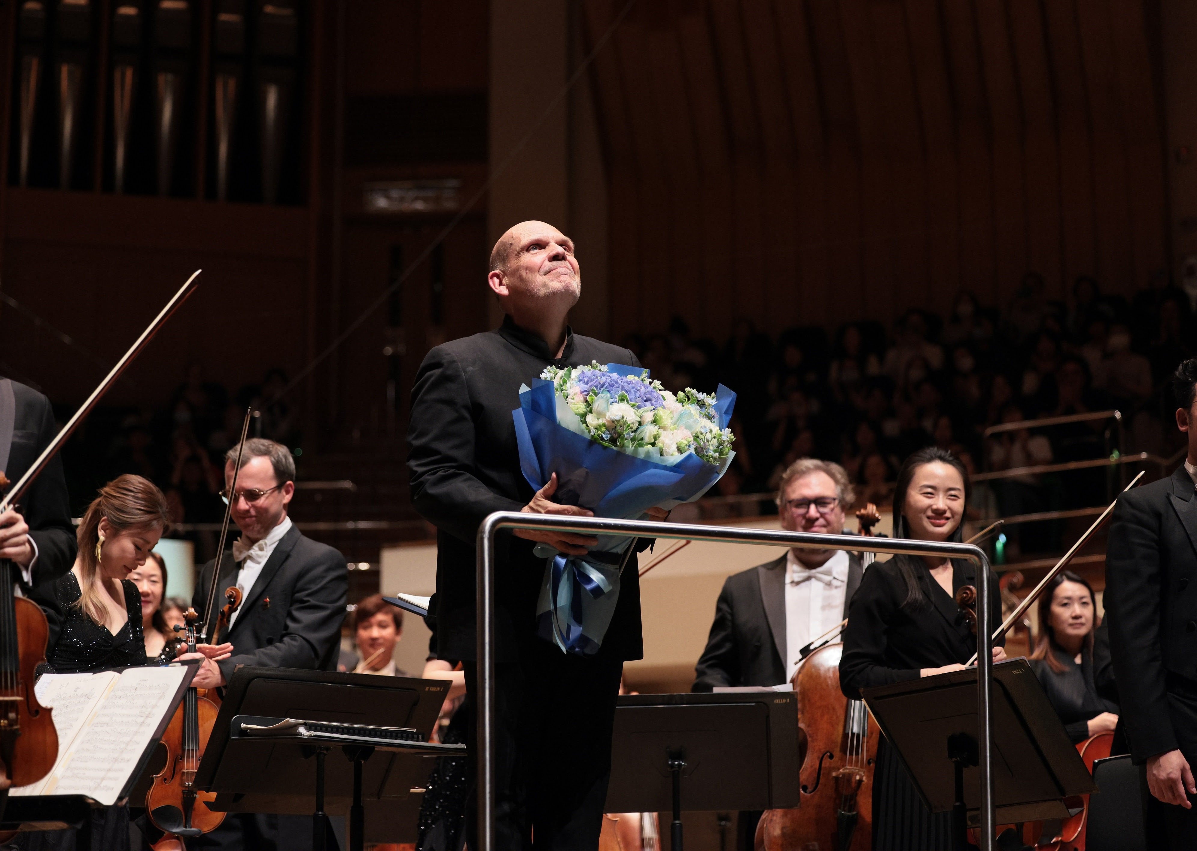 Jaap van Zweden and the Hong Kong Philharmonic Orchestra receive the applause of the audience at the end of his farewell concert on June 25, 2024. The Dutchman has stepped down as music director after 12 years. Photo: Keith Hiro/HK Phil
