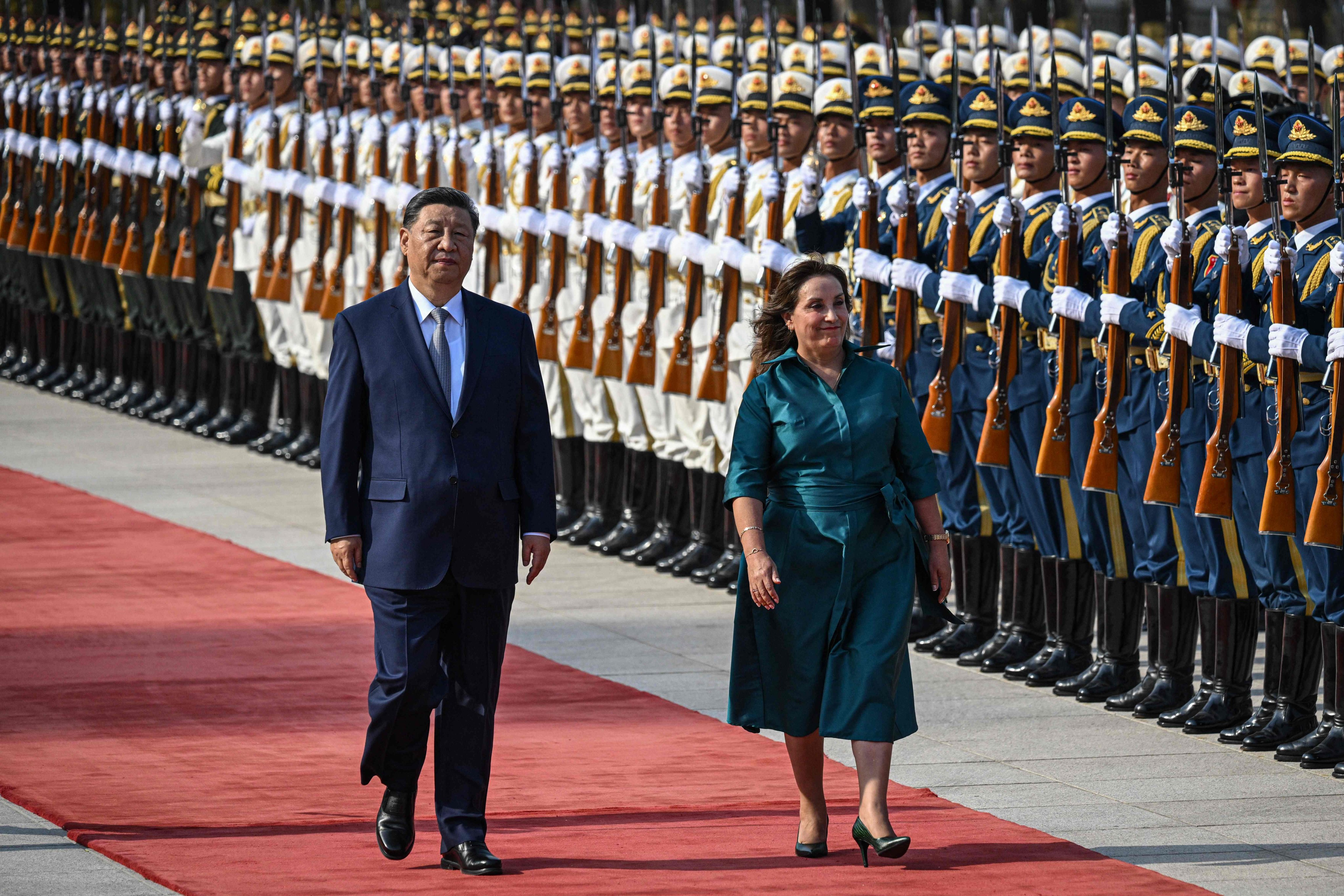 Chinese President Xi Jinping (left) and Peruvian President Dina Boluarte review the honour guard during the welcome ceremony at the Great Hall of the People in Beijing on Friday. Photo: AFP