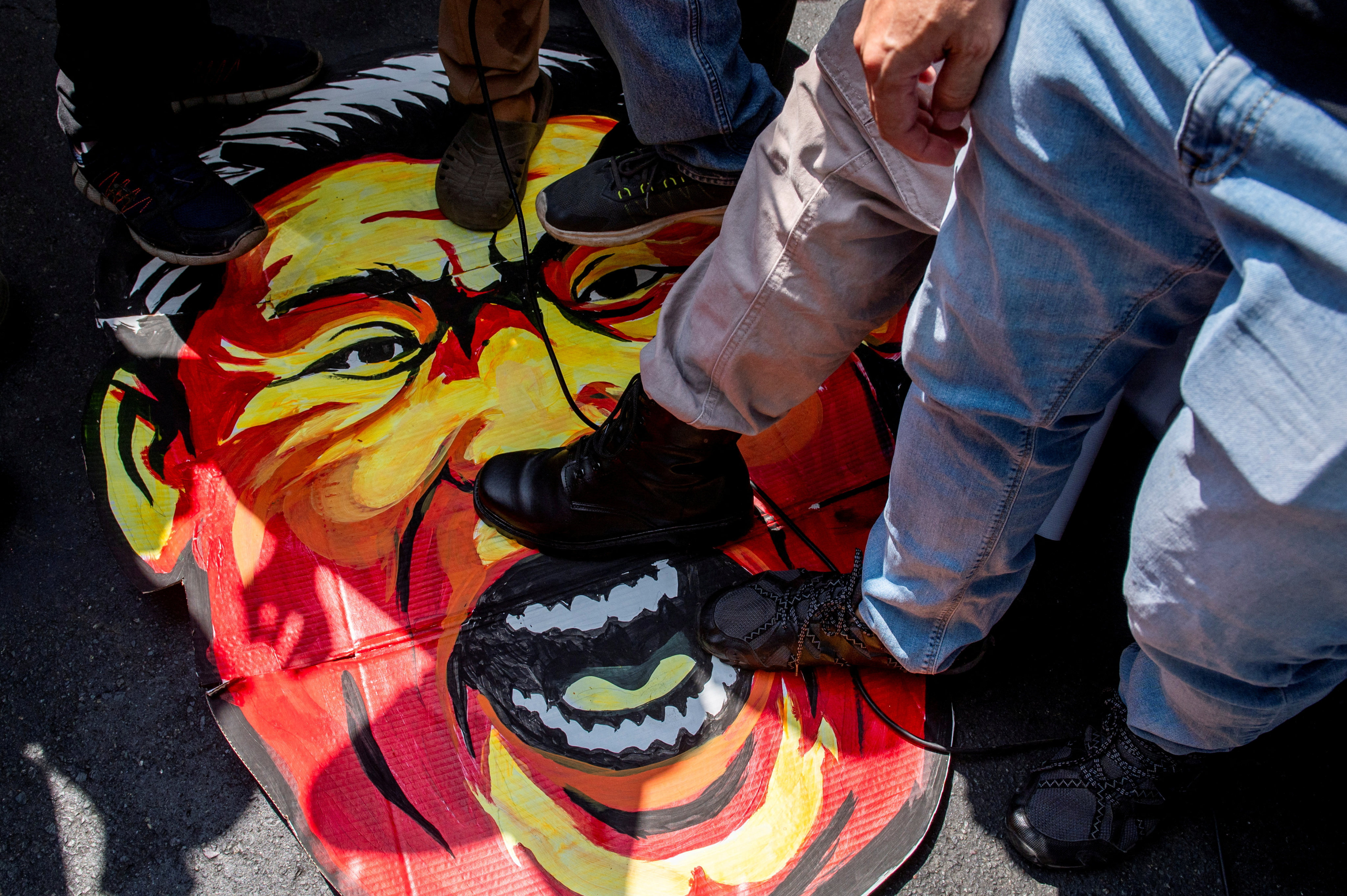 Filipino activists step on a caricature of Chinese President Xi Jinping during a protest condemning China’s actions in the South China Sea. Photo: Reuters