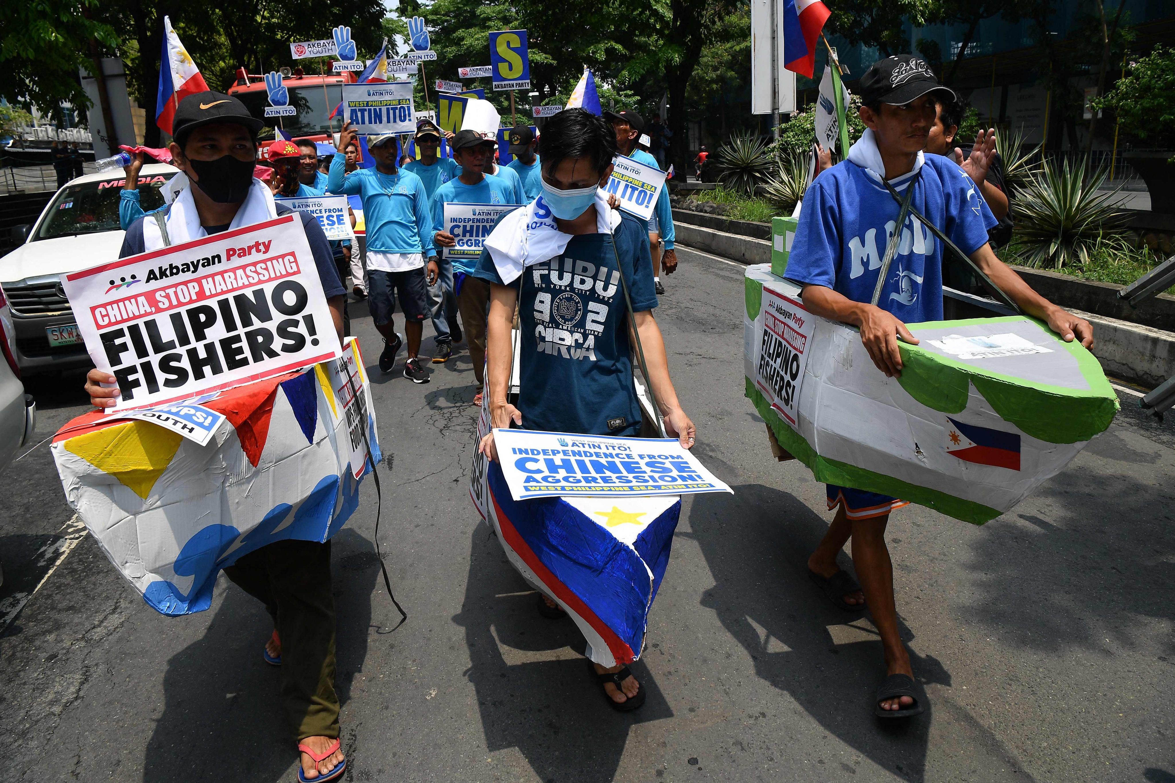 Filipino fishermen march towards the Chinese consulate during an anti-China protest in Manila on June 11. Photo: AFP