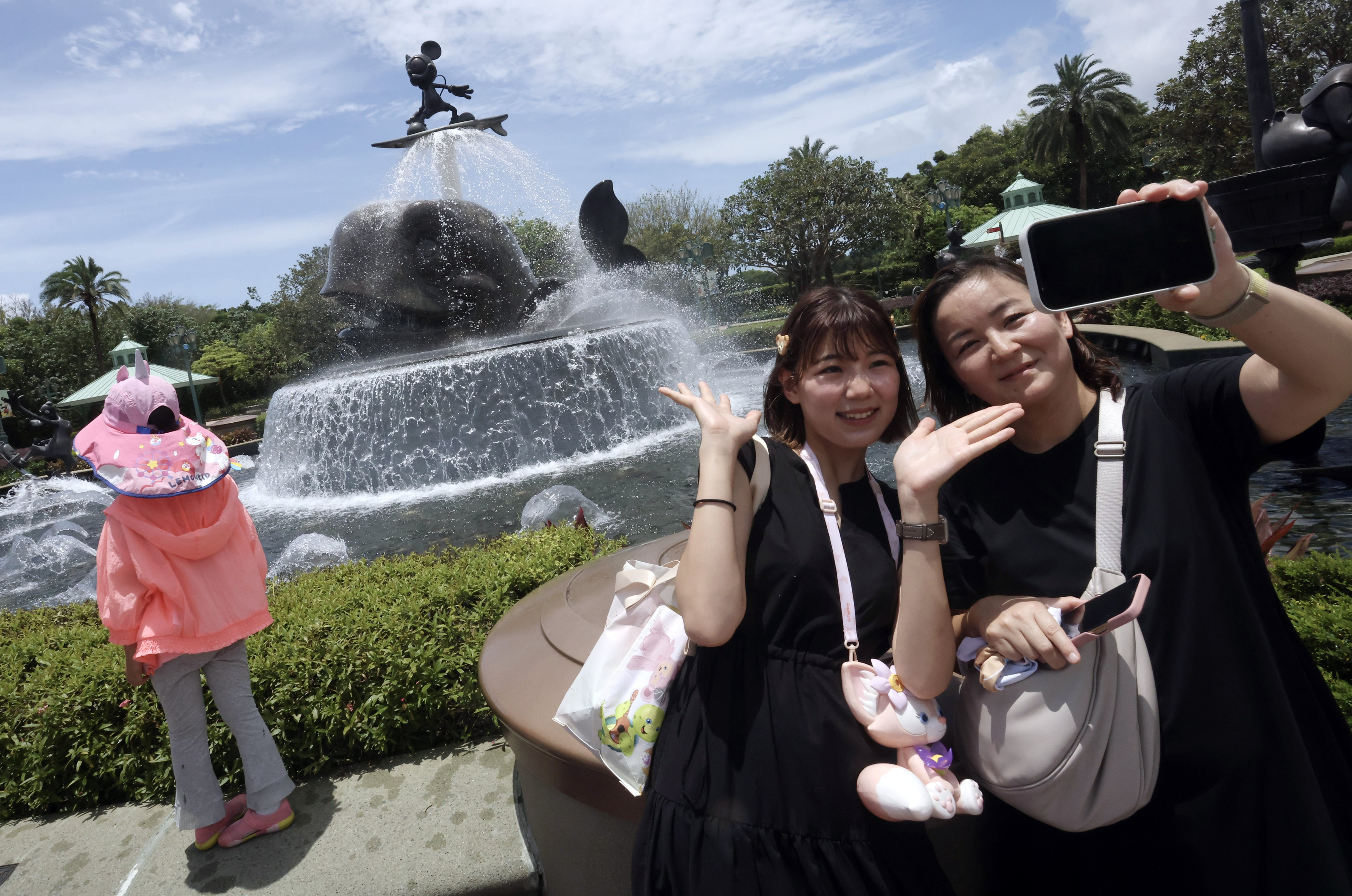 Visitors at Hong Kong Disneyland, which reduced its net losses by 83 per cent to HK$356 million (US$45.6 million) in 2023. Photo: SCMP / Jonathan Wong