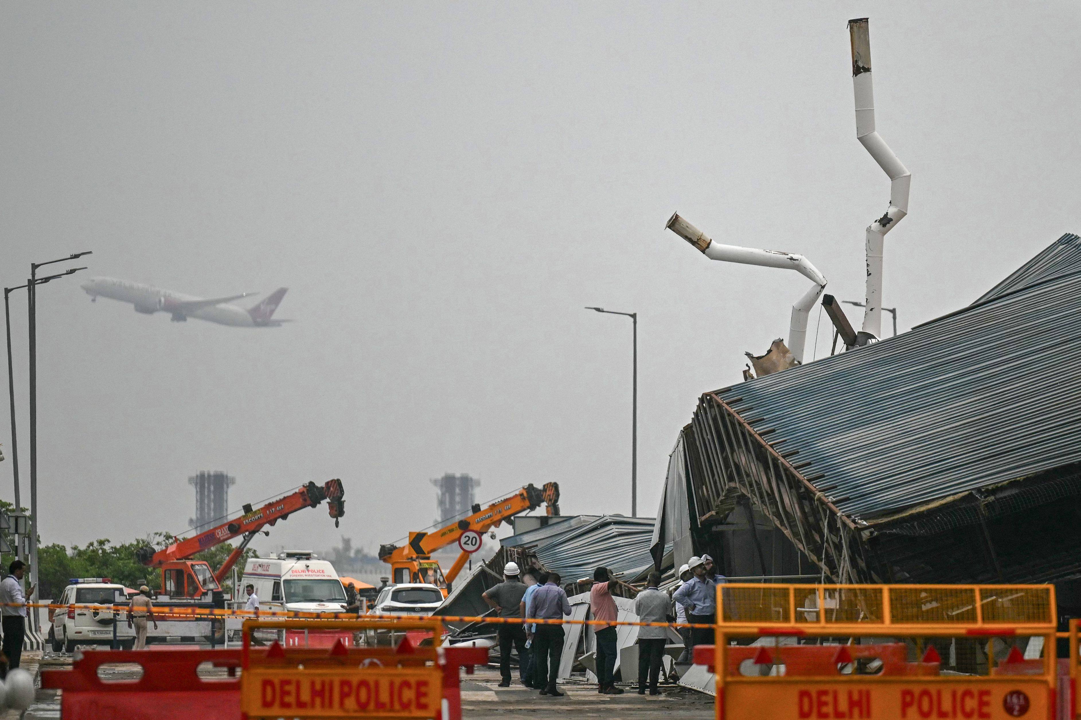 Rescuers work at the collapsed terminal roof of New Delhi’s international airport on June 28. Photo: AFP