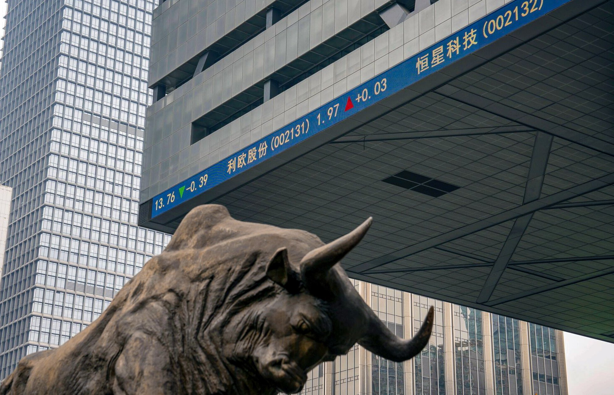 A bull statue in front of the Shenzhen Stock Exchange building. Photo: Bloomberg