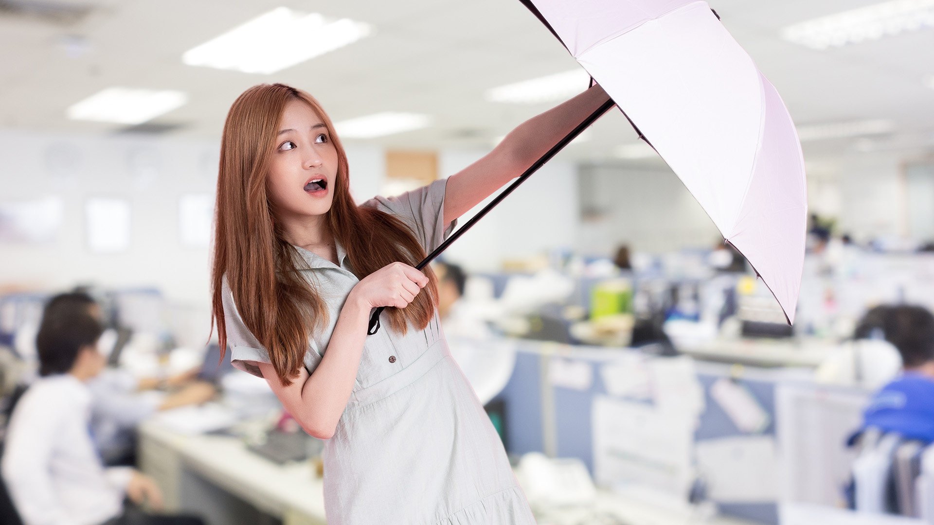 Corporate management complained that the woman used umbrellas to hide her desk from supervisors. 
Photo: SCMP composite/Shutterstock