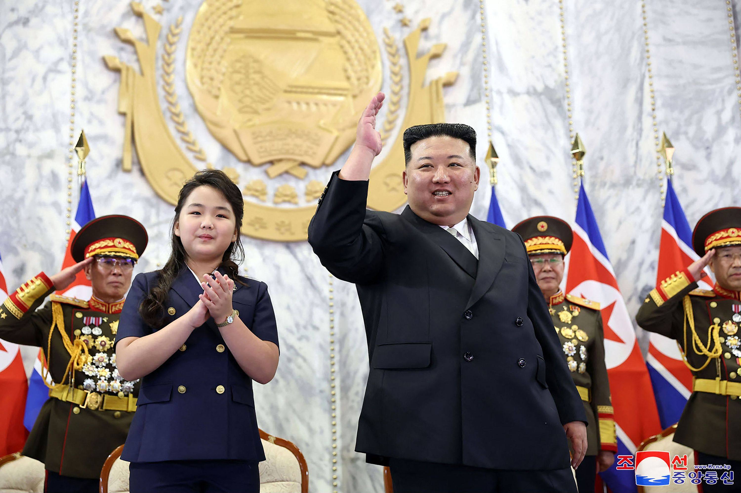 North Korean leader Kim Jong-un and his daughter attending the paramilitary parade at Kim Il-sung Square in Pyongyang. Photo: KCNA VIA KNS/AFP