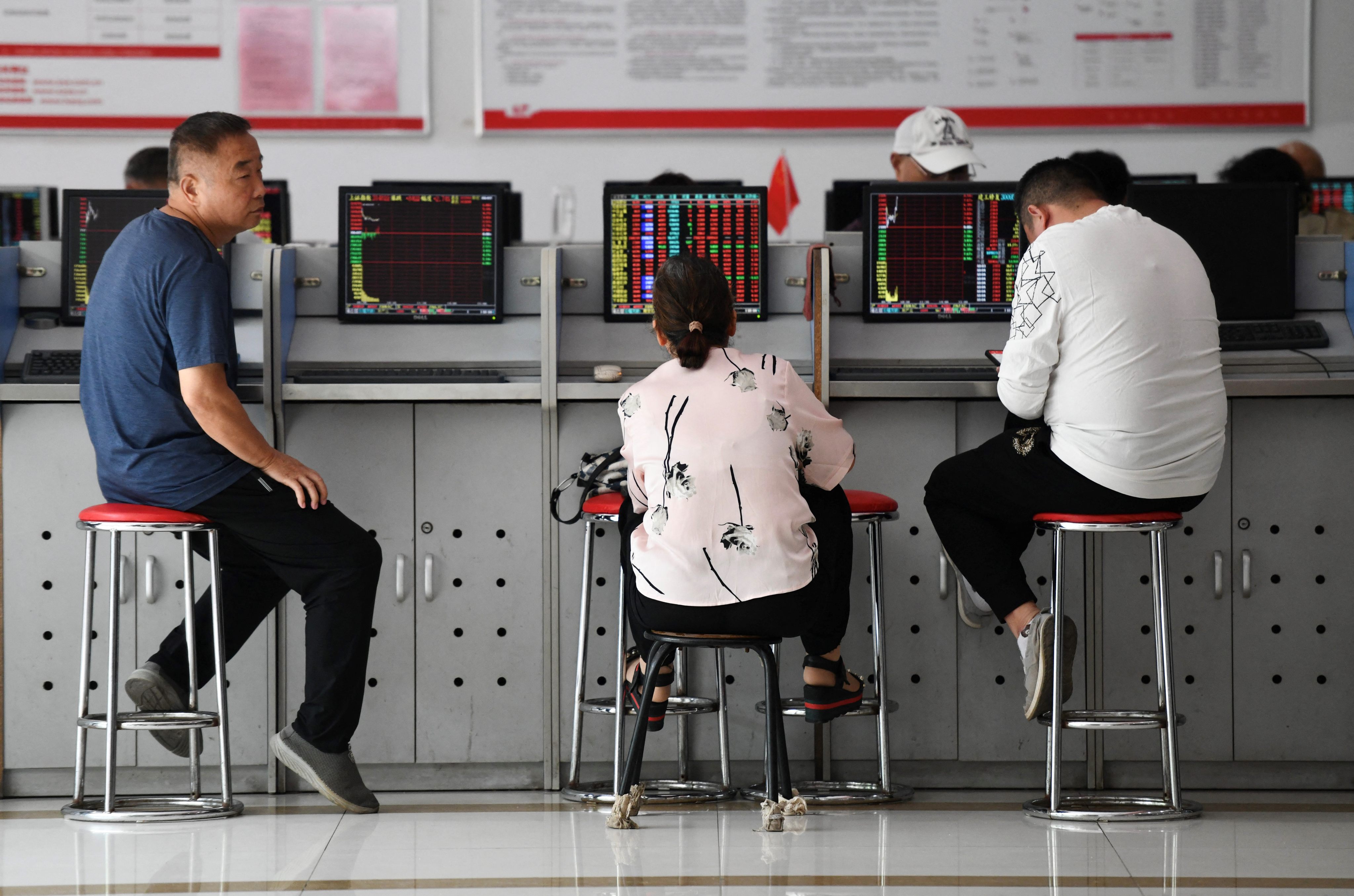 Investors at a securities company in Fuyang, in China’s eastern Anhui province on August 28, 2023. Photo: AFP