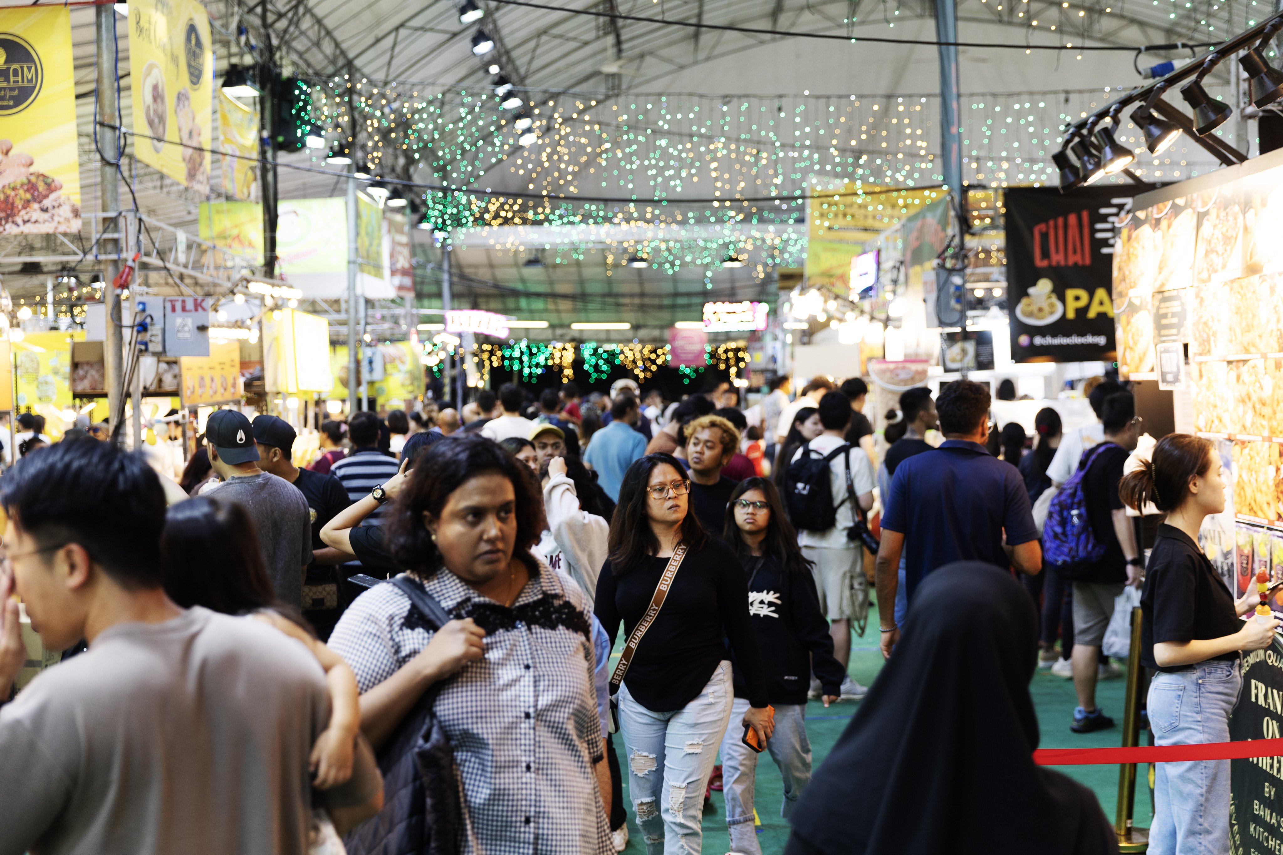 People walk at the Geylang Serai Ramadan Bazaar ahead of the Eid Al-Fitr celebration, in April. Singapore has fared well in global studies for its management of race relations, Law Minister K Shanmugam has said. Photo: EPA-EFE