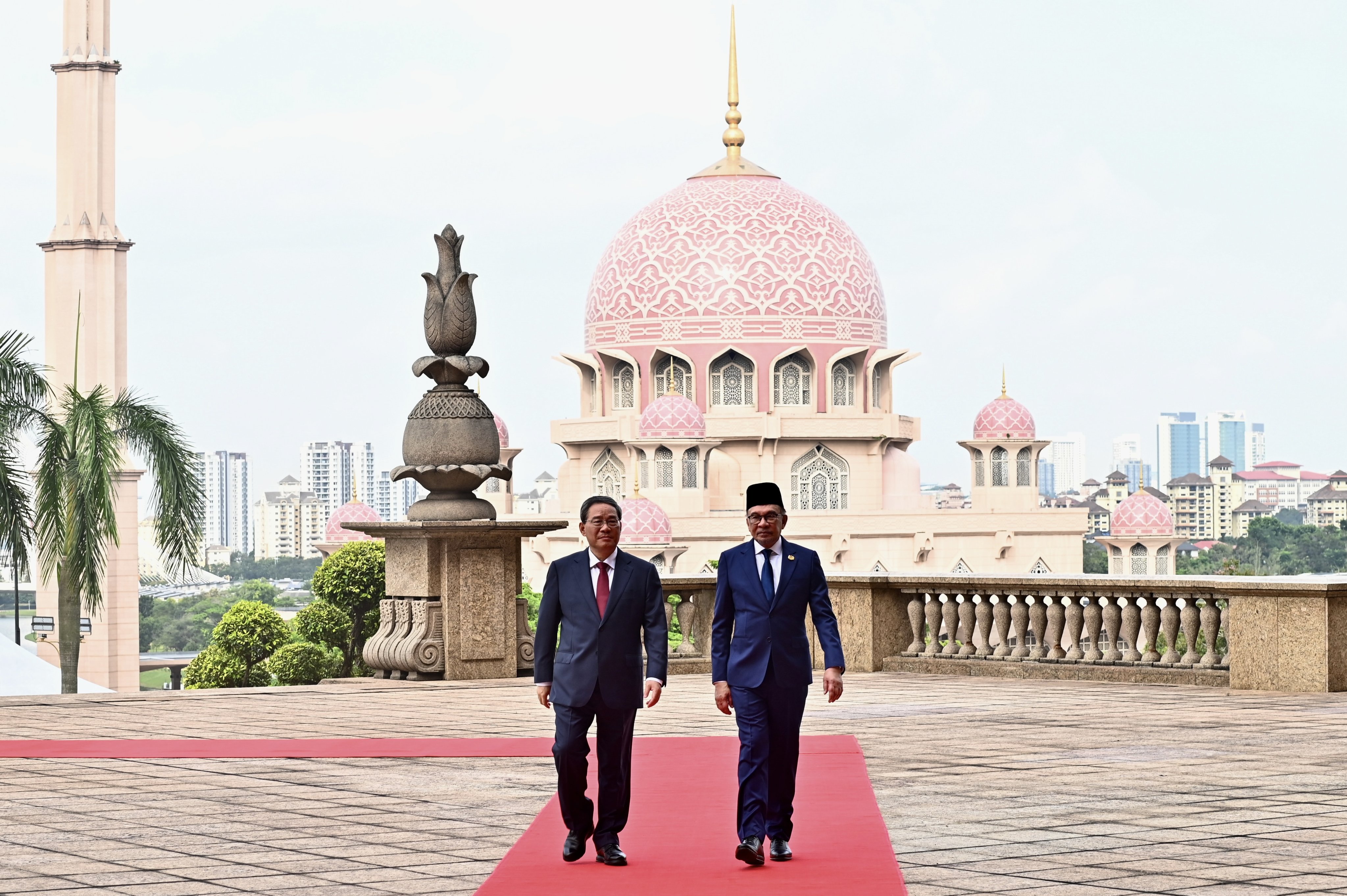 Chinese Premier Li Qiang (left) and Malaysian Prime Minister Anwar Ibrahim during a welcome ceremony at the prime minister’s office in Putrajaya, south of Kuala Lumpur, on June 19. Li’s official three-day visit was the latest entry in Chinese outreach to Malaysia that is seen in some quarters as trying to pull Putrajaya more into Beijing’s orbit. Photo: EPA-EFE