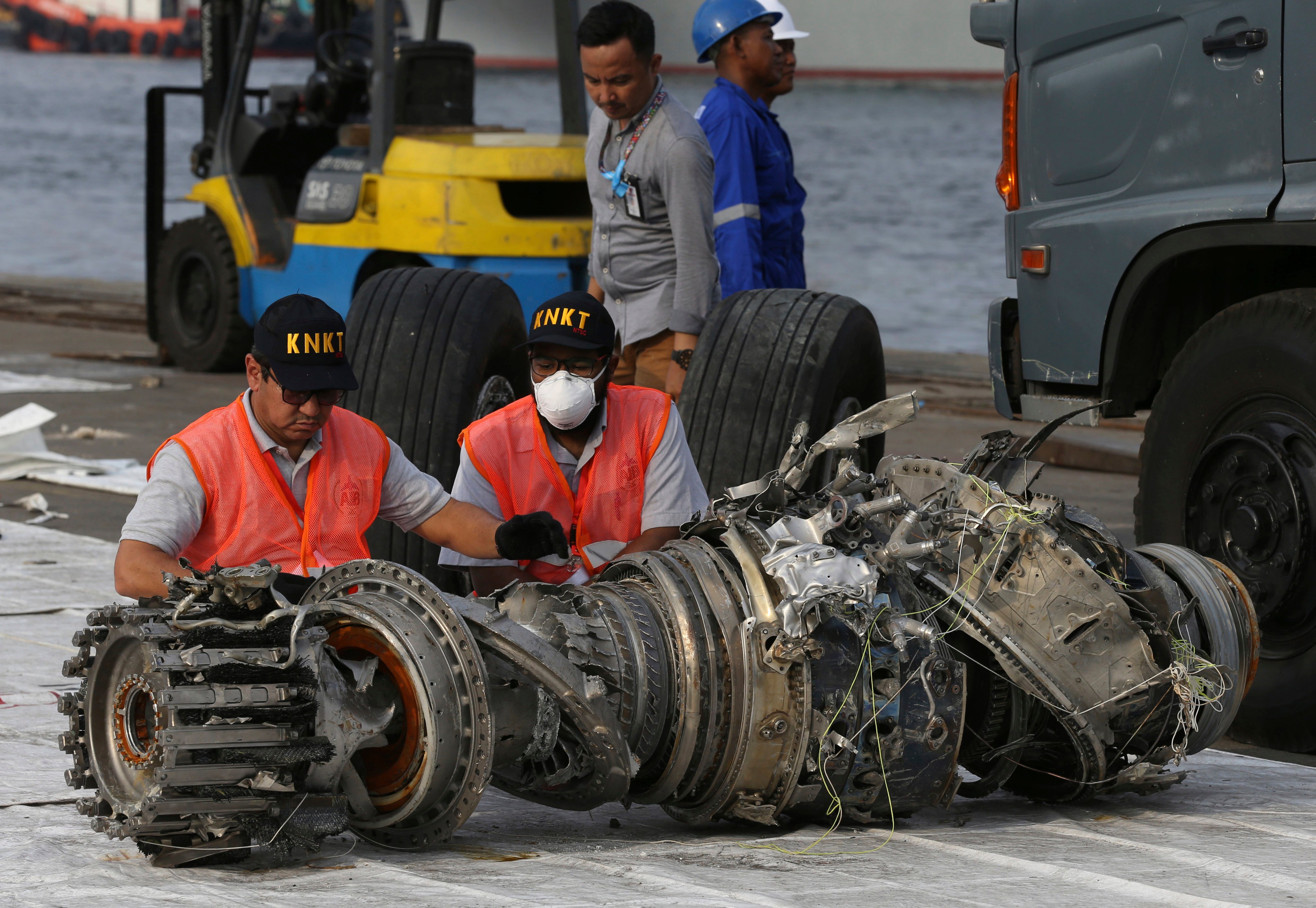 Indonesian officials inspect an engine recovered from the crashed Lion Air jet in 2018. File photo: AP