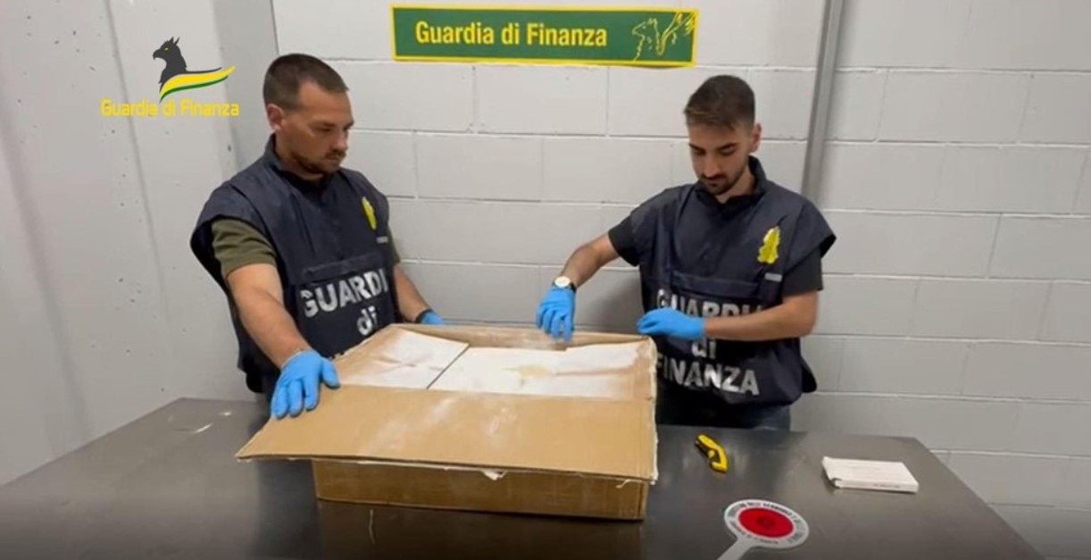 Italian officials open a box believed to contain drug precursors. Photo: Guardia di Finanza 