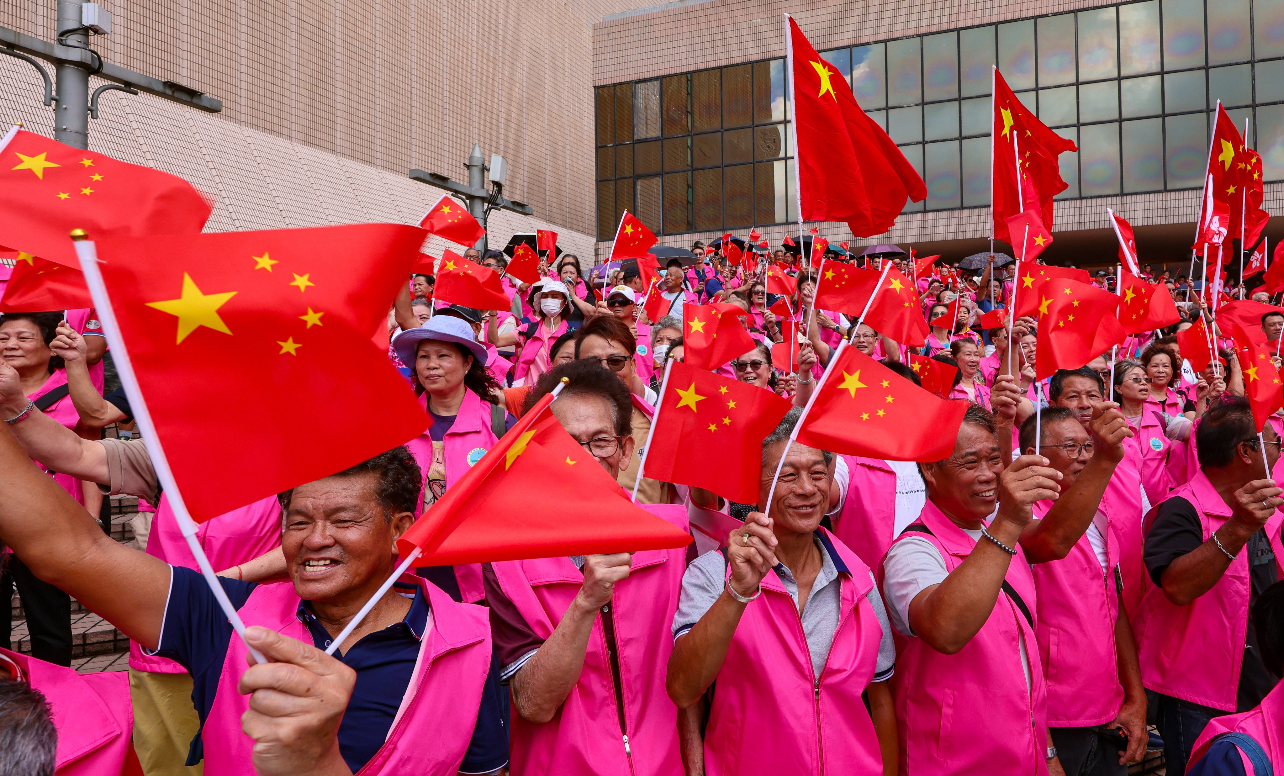 Spectators fly the flag at an event in Hong Kong to mark the July 1 anniversary on Monday. Photo: Jelly Tse