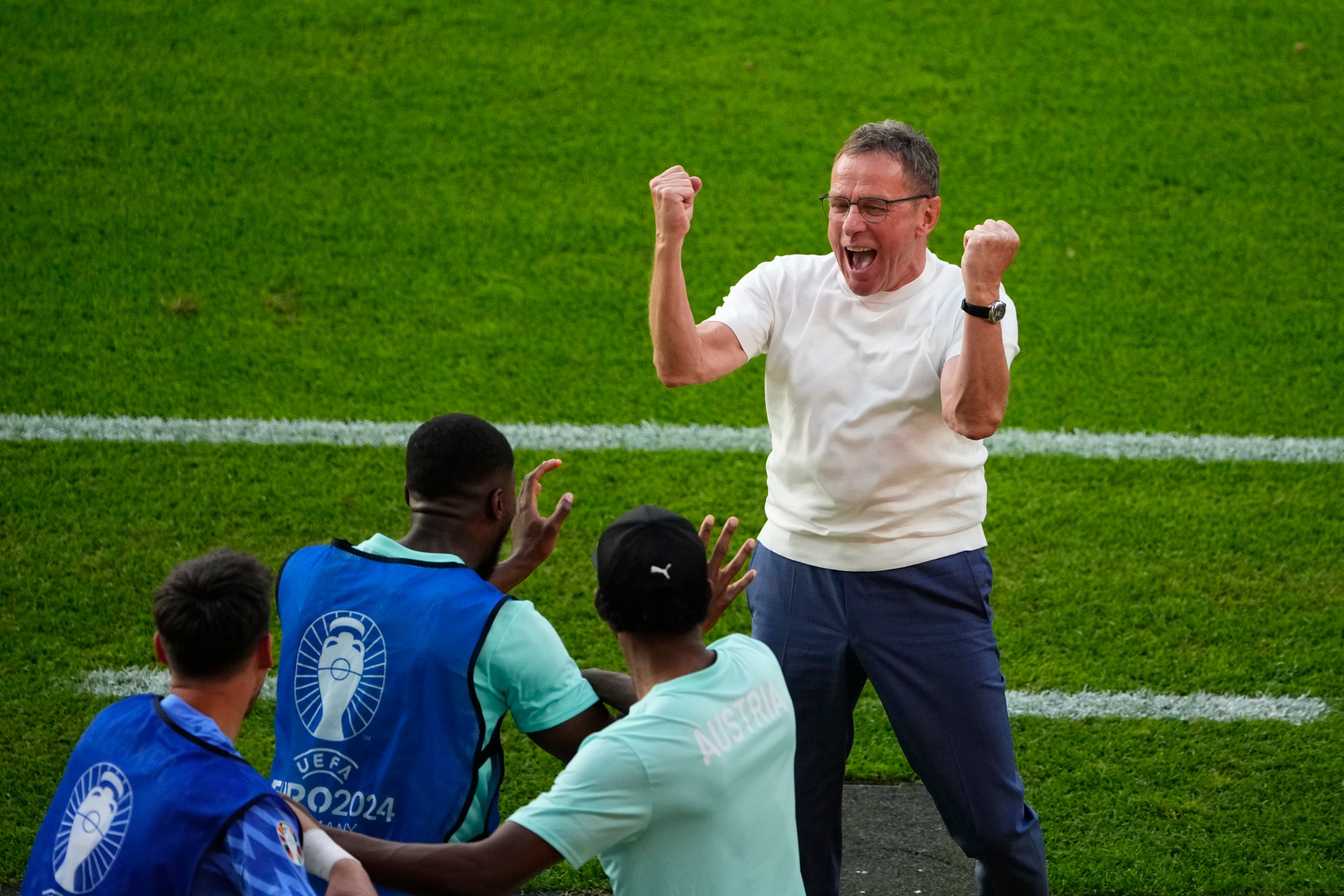 Austria head coach Ralf Rangnick celebrates after their win over the Netherlands that helped them win Group D, which also contained France. Photo: AP