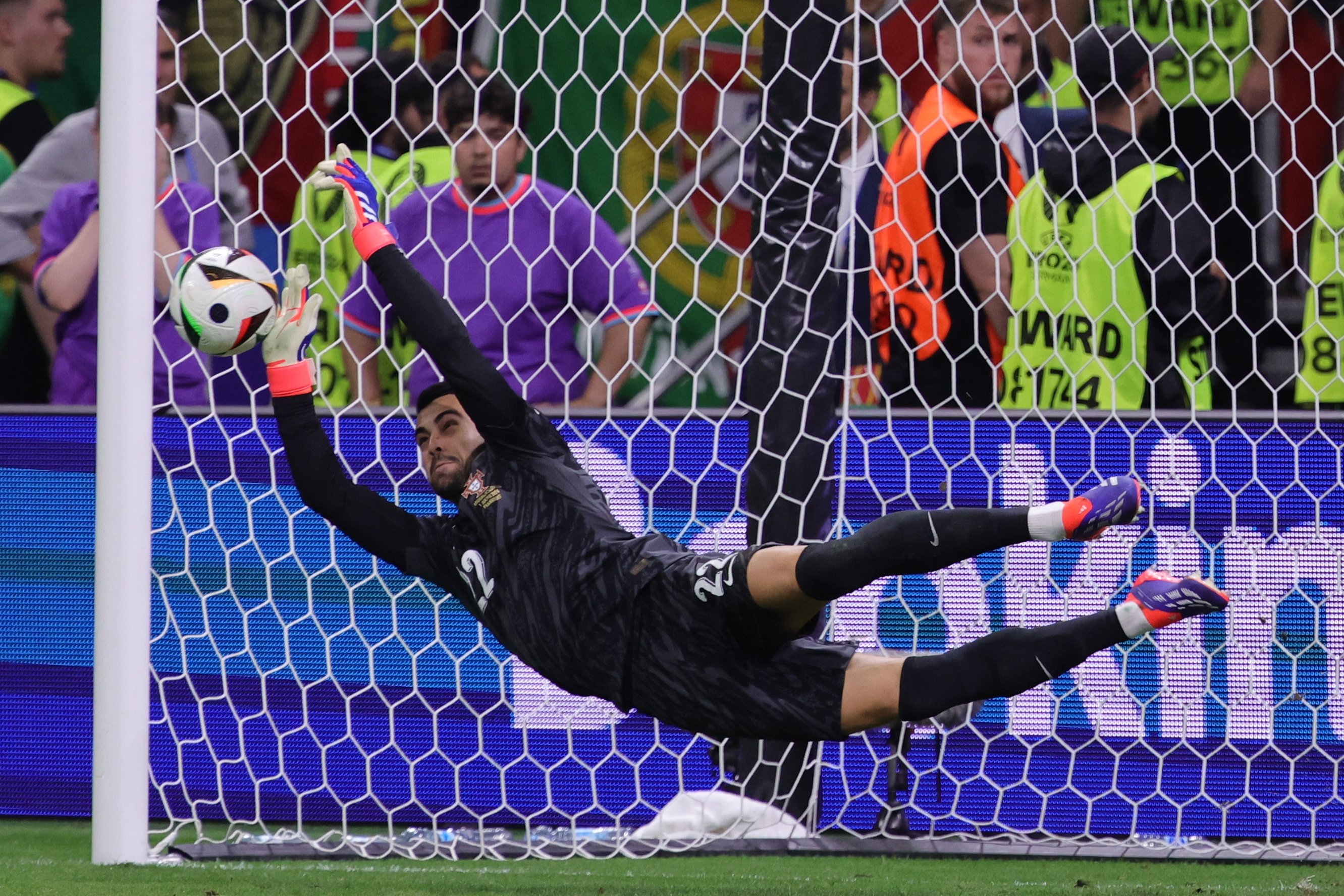 Portugal goalkeeper Diogo Costa saves a penalty during the shootout against Slovenia, in Frankfurt, Germany on Monday. Photo: EPA-EFE