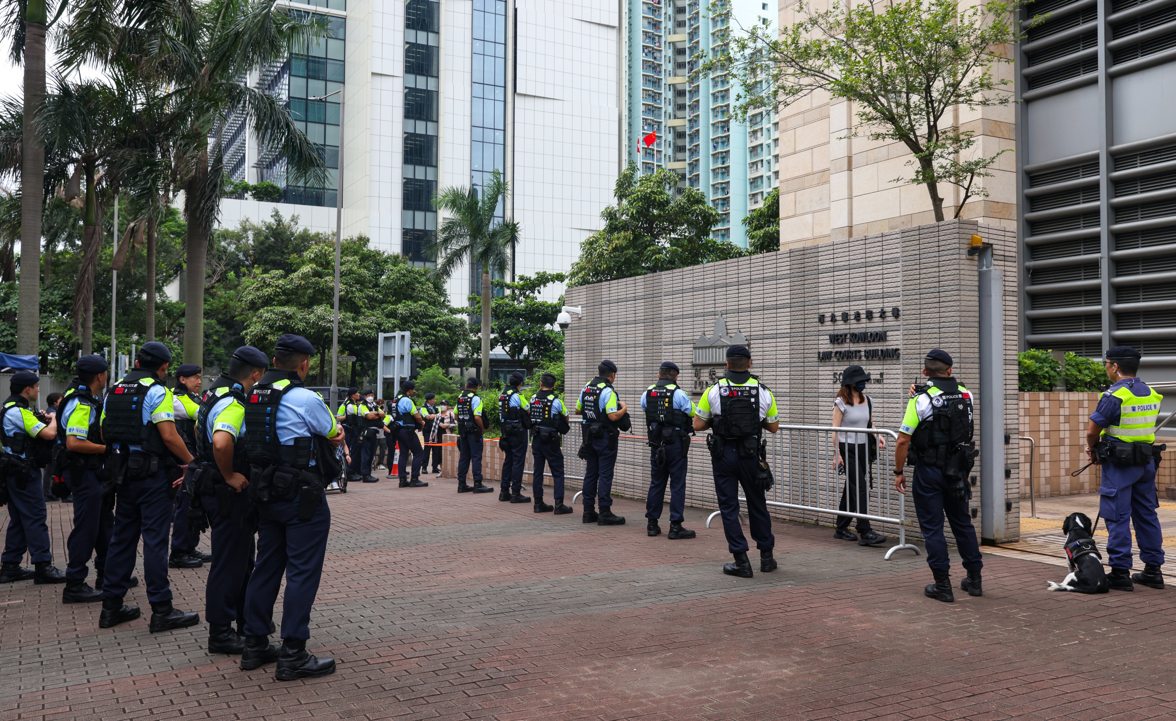 Police officers stand guard outside West Kowloon Court amid legal proceedings. Photo: Yik Yeung-man