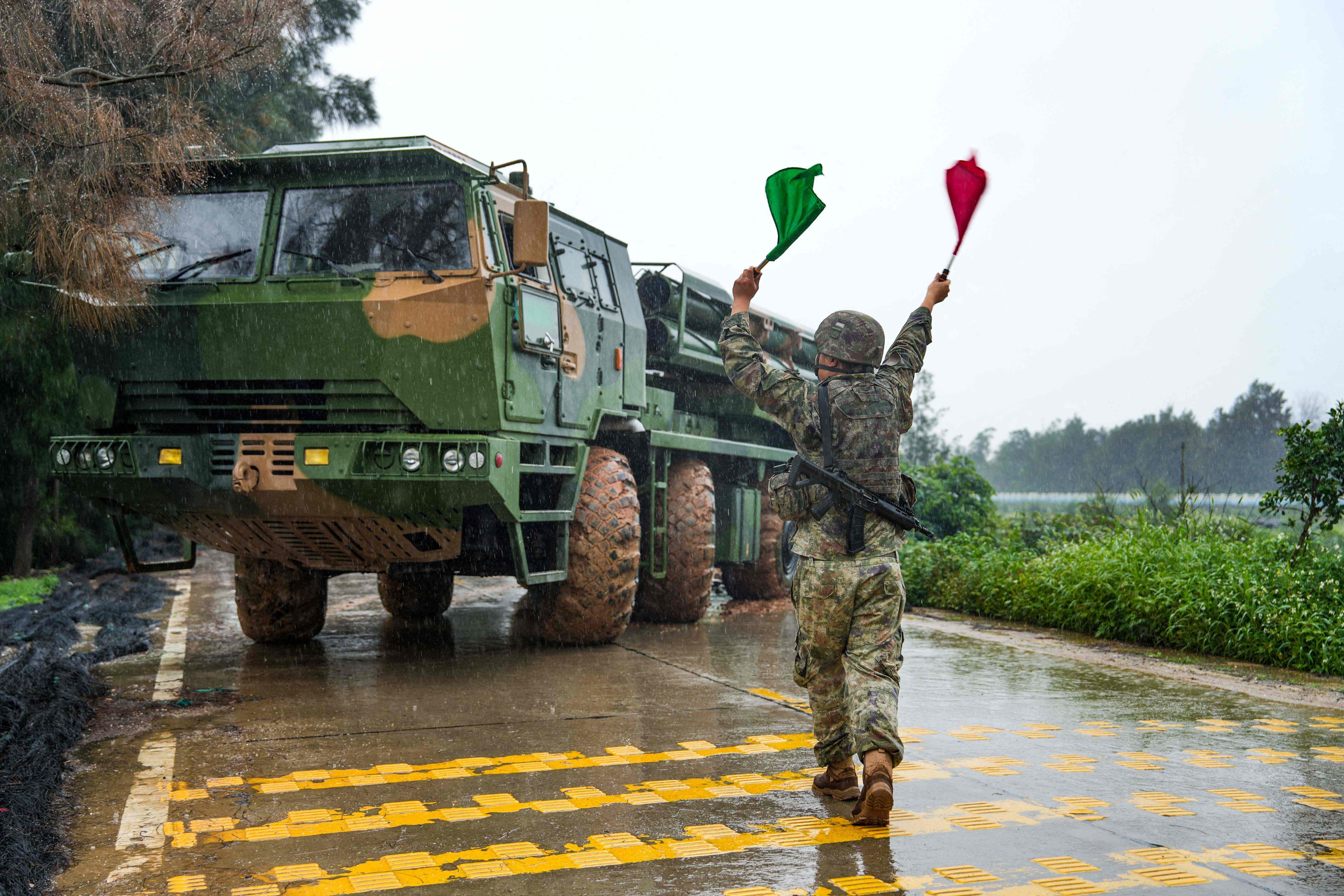 A mainland Chinese soldier directs a rocket launcher during a military drill in Fujian province, China, on May 23 amid tensions over Taiwan. Photo: AFP/PLA