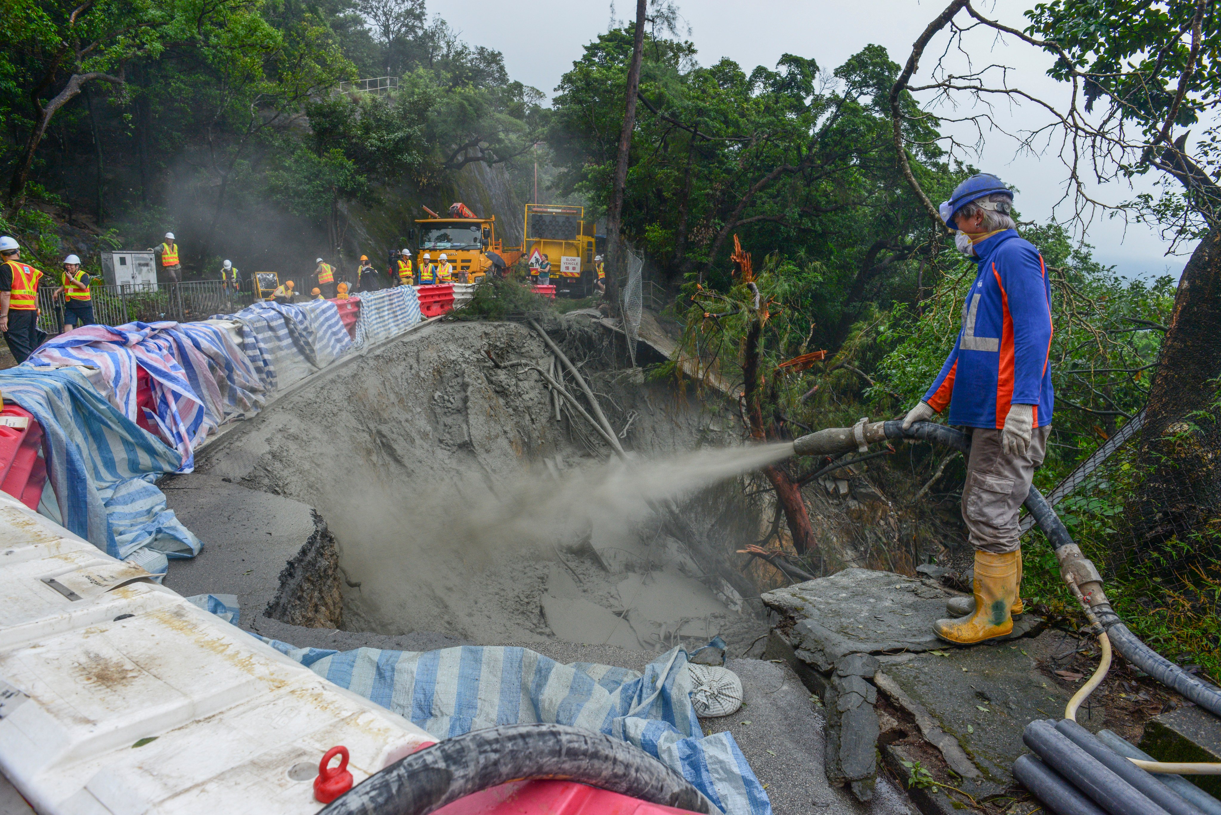 Shek O Road was forced to close for more than a day last September when record rainfall triggered two massive landslides along the route and cut off 200 residents living in the area. Photo: Antony Dickson