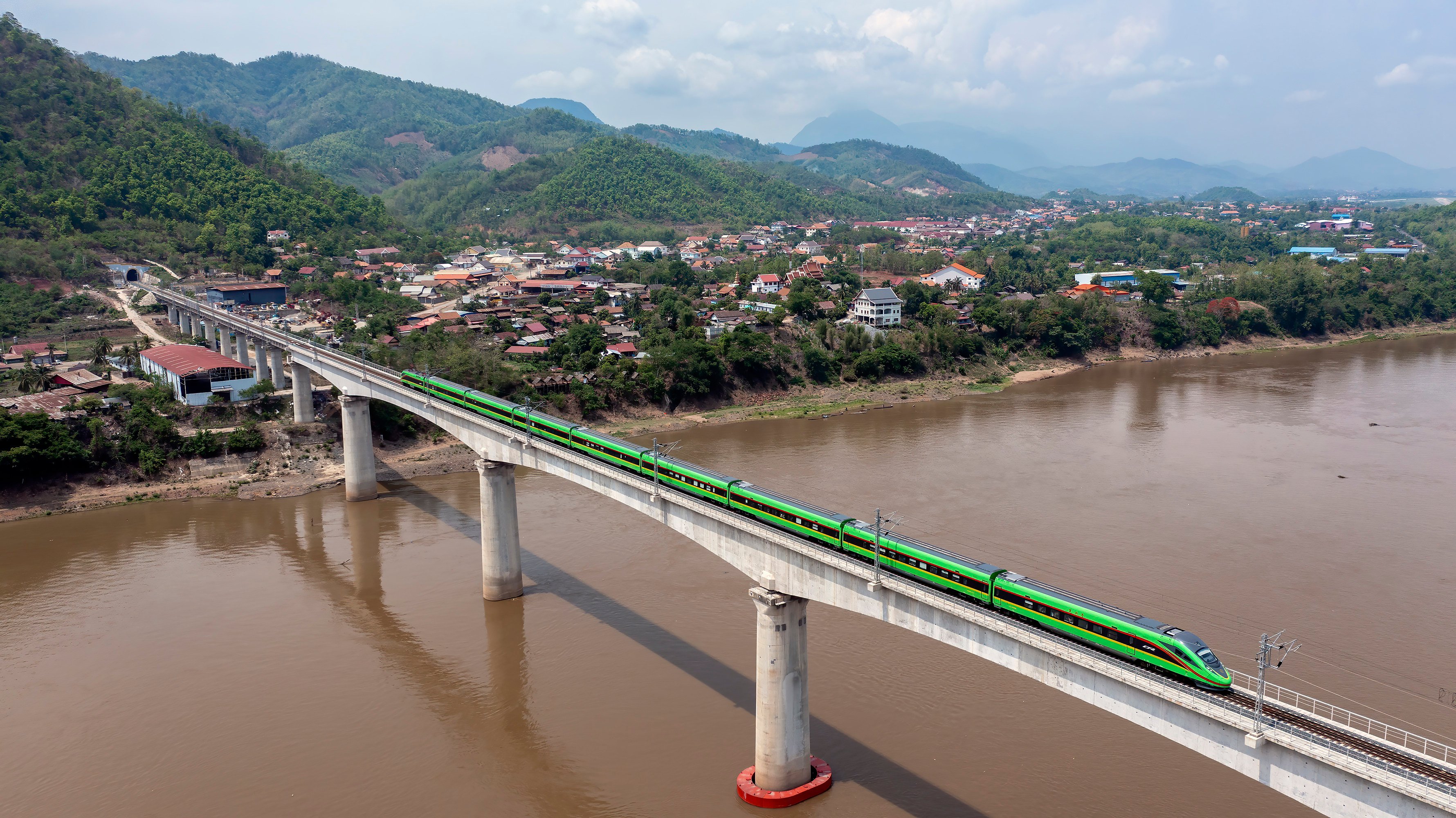A train travels across the Mekong river on a bridge of the China-Laos Railway, which cost the landlocked country about US$6 billion. Photo: Xinhua