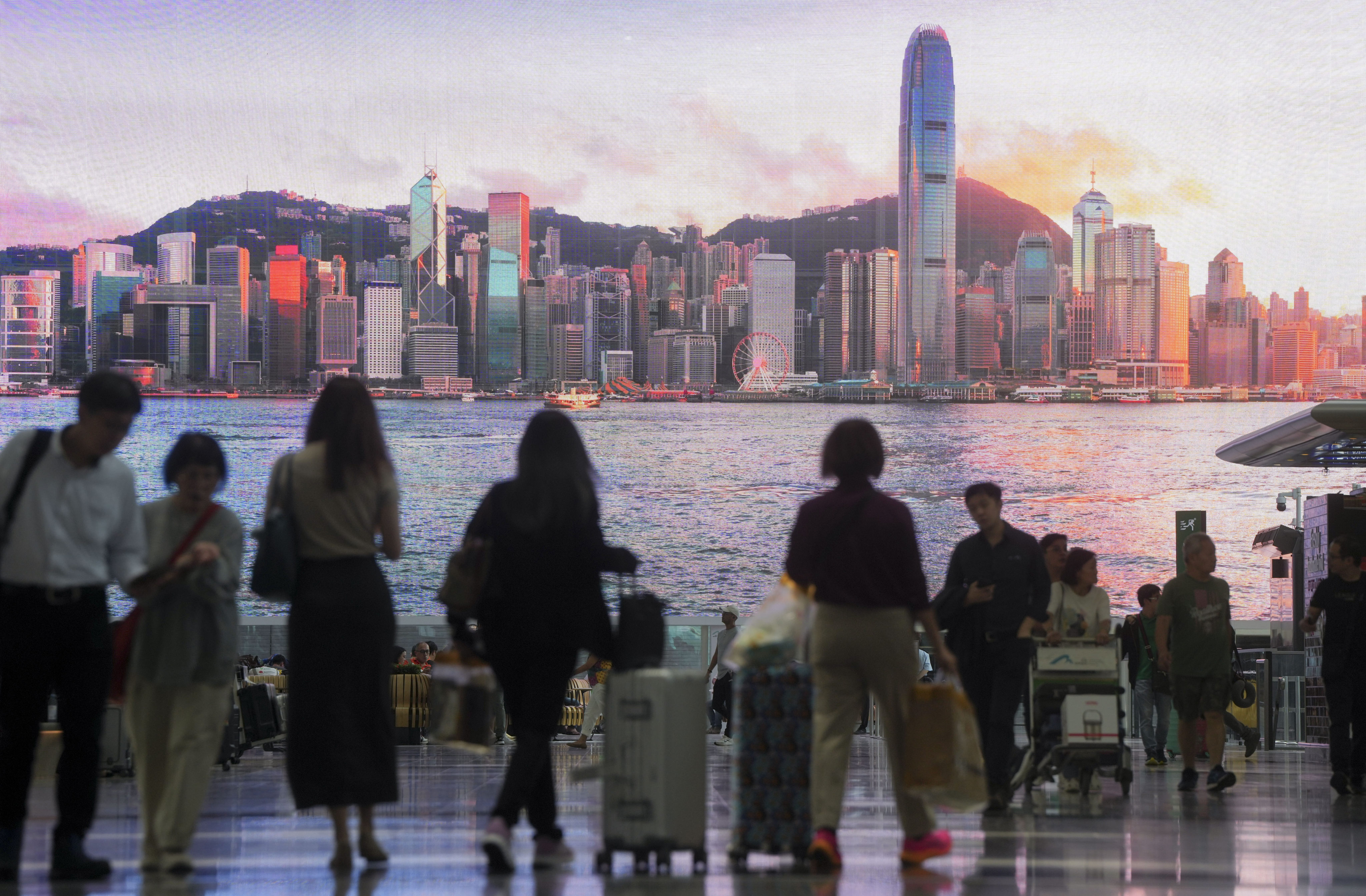 A giant monitor shows a view of Hong Kong in the Departure Hall at Hong Kong International Airport on June 18, 2024. Photo: Sam Tsang