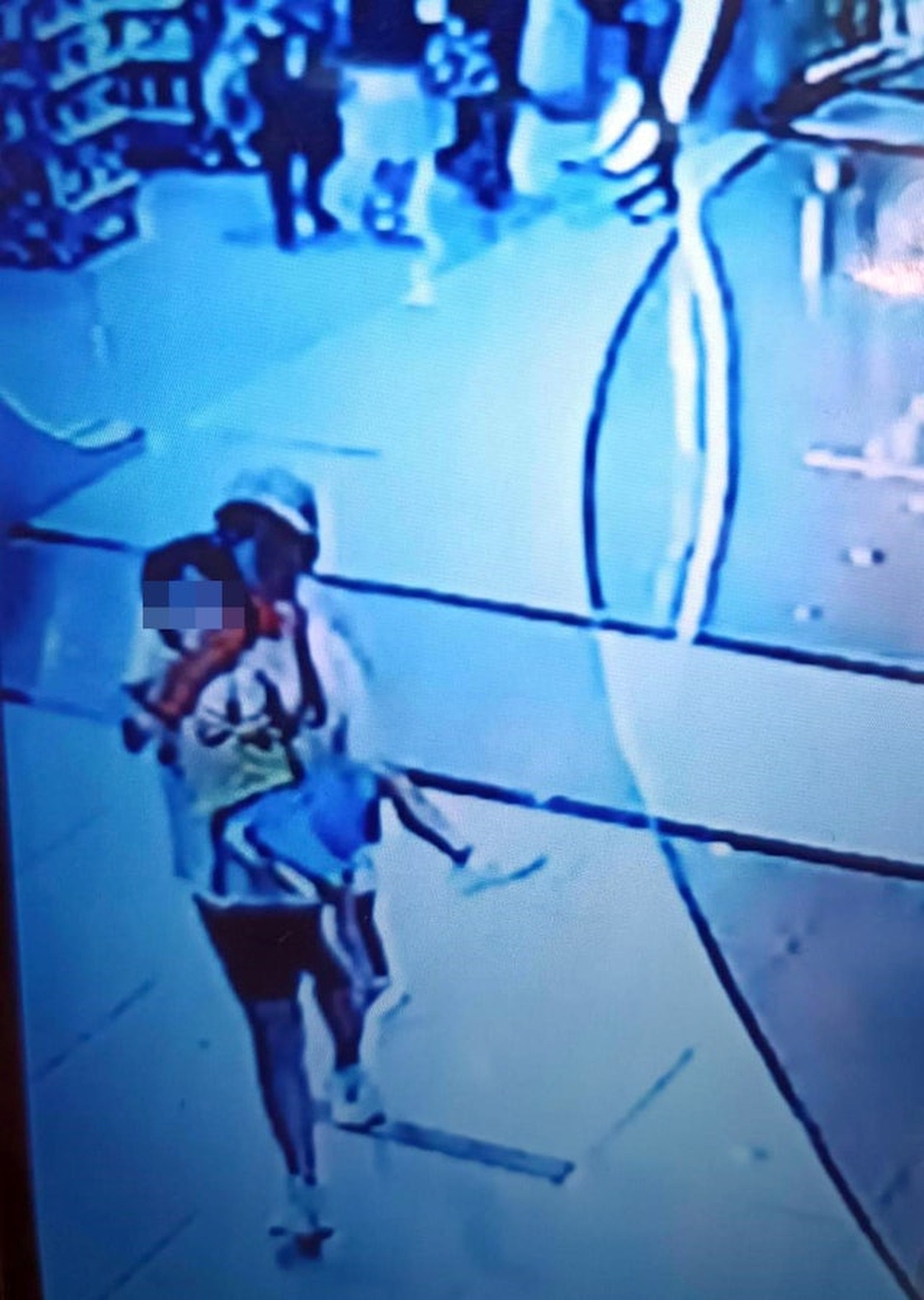 A CCTV image of a three-year-old boy being snatched from a Hong Kong shopping centre. Photo: FACEBOOK/ Vanessa Chan