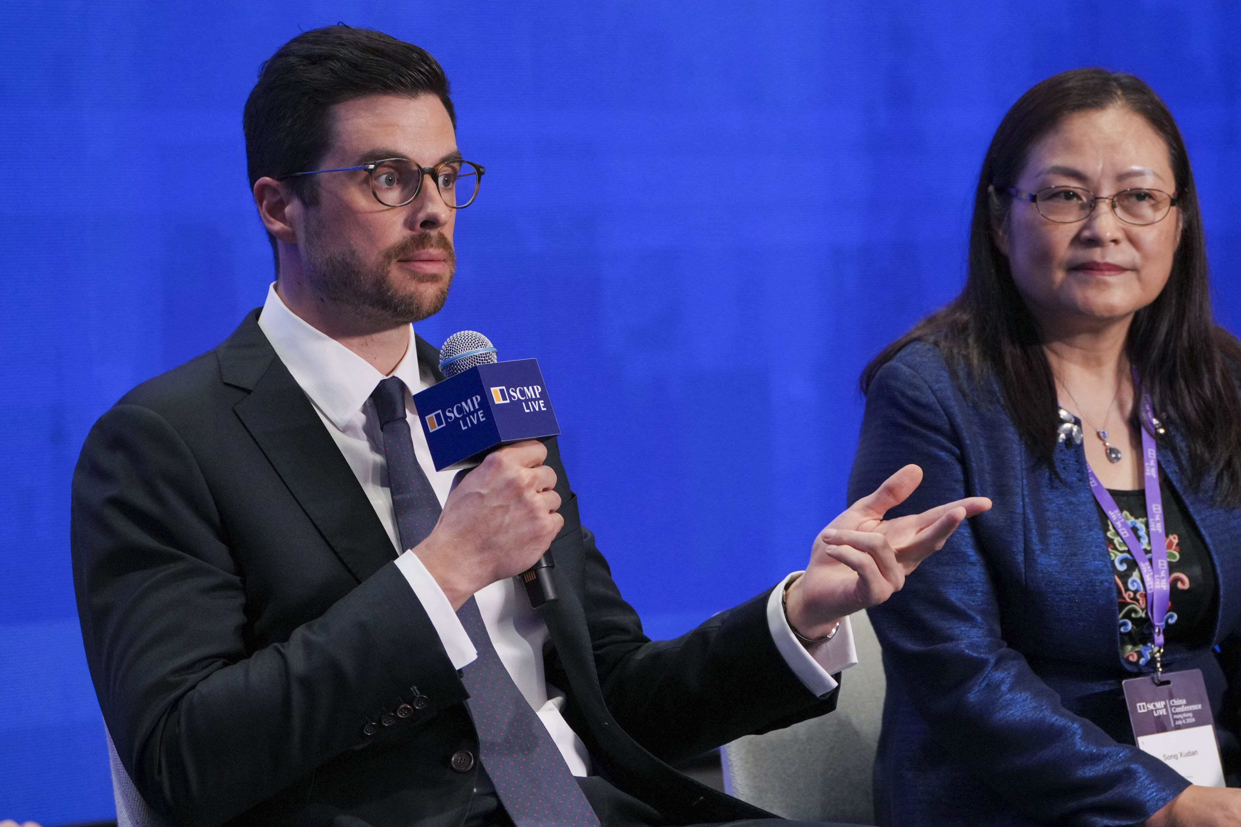 Christian Romig (left), associate director at Boston Consulting Group, and Song Xudan, senior executive vice-president of EDF China, at the China Conference on Thursday. Photo: May Tse