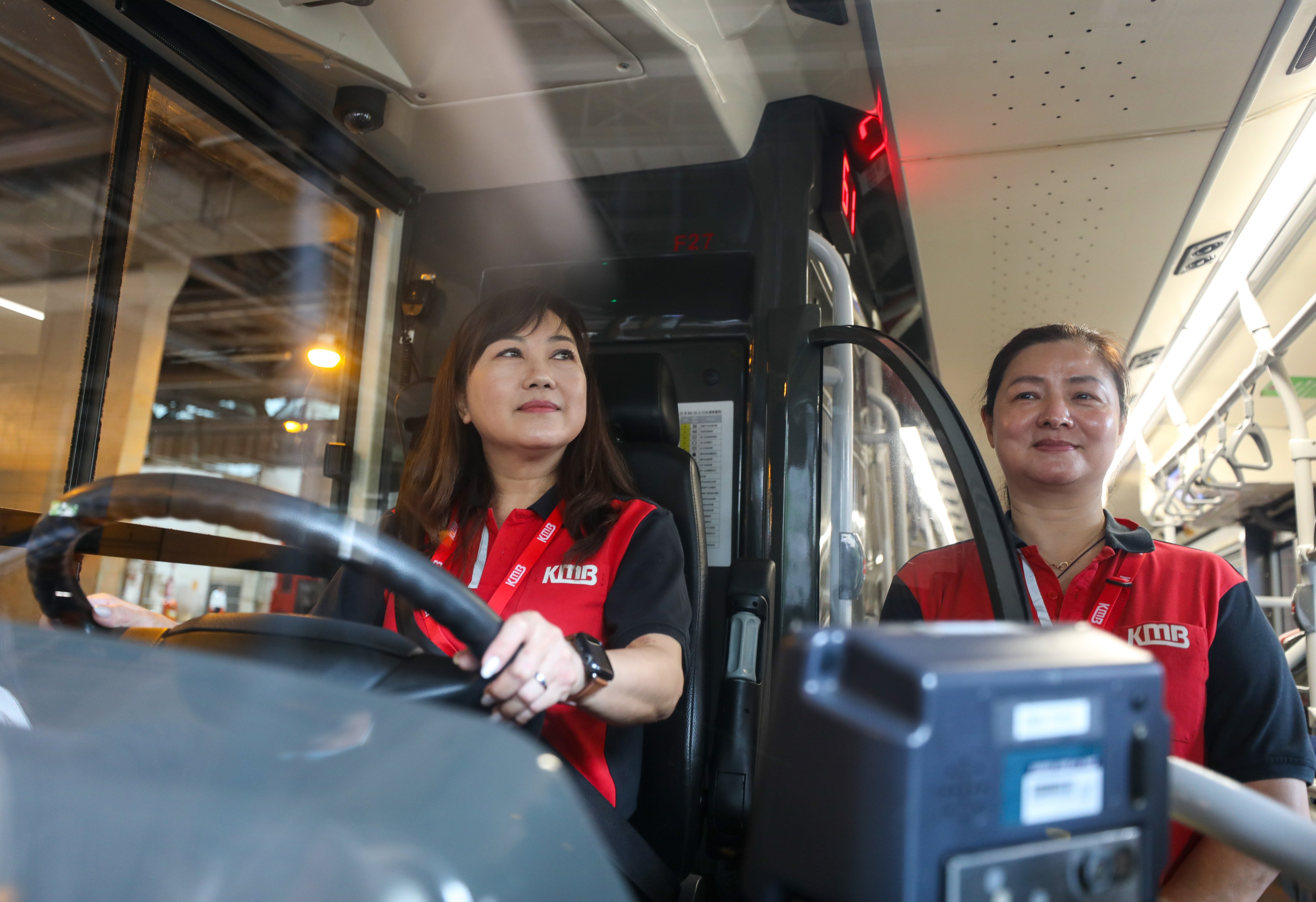 KMB bus drivers Janet Choi (left) and Cheung Yu at Tin Shui Wai Town Center Bus Terminal. Photo: Xiaomei Chen