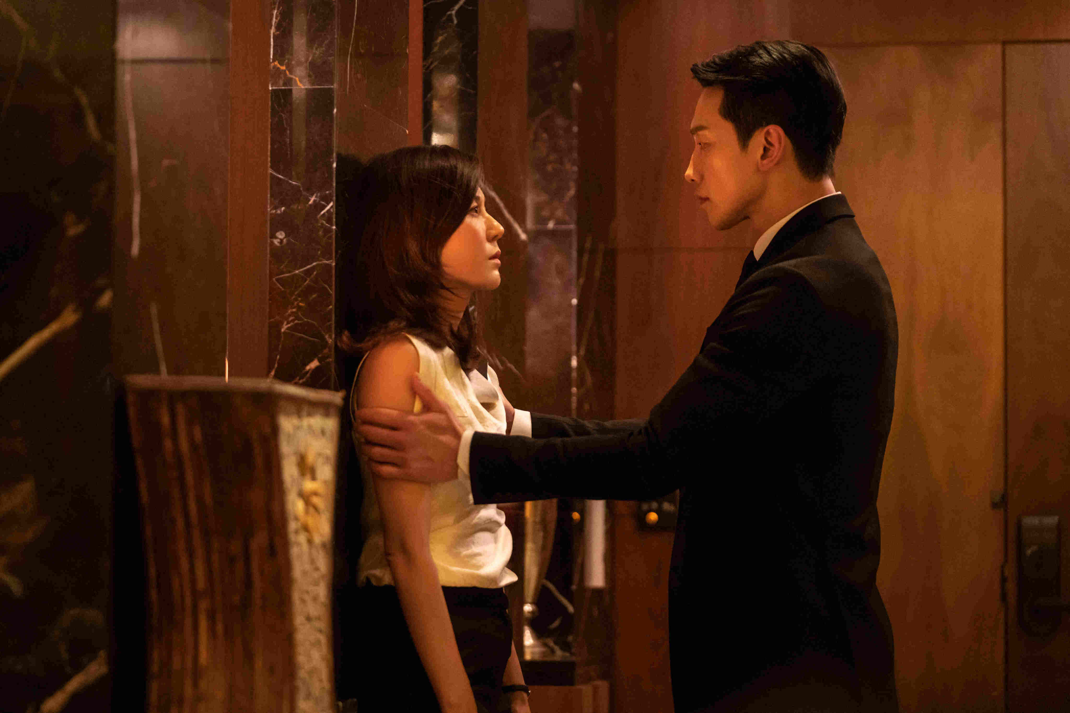 Kim Ha-neul (left) and Rain in a still from Red Swan. Photo: Disney+