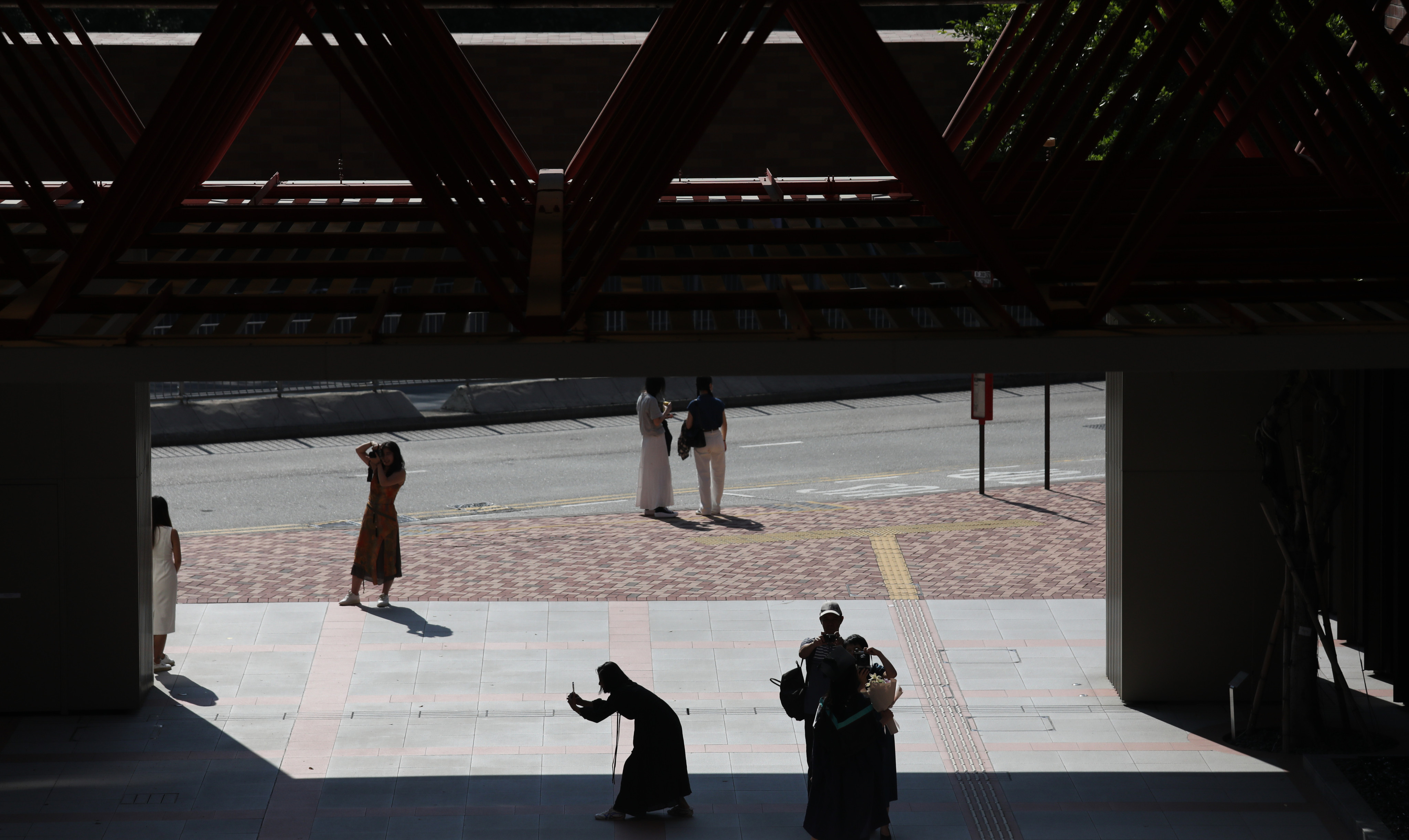 People take photos at Polytechnic University during graduation season. Photo: Xiaomei Chen 