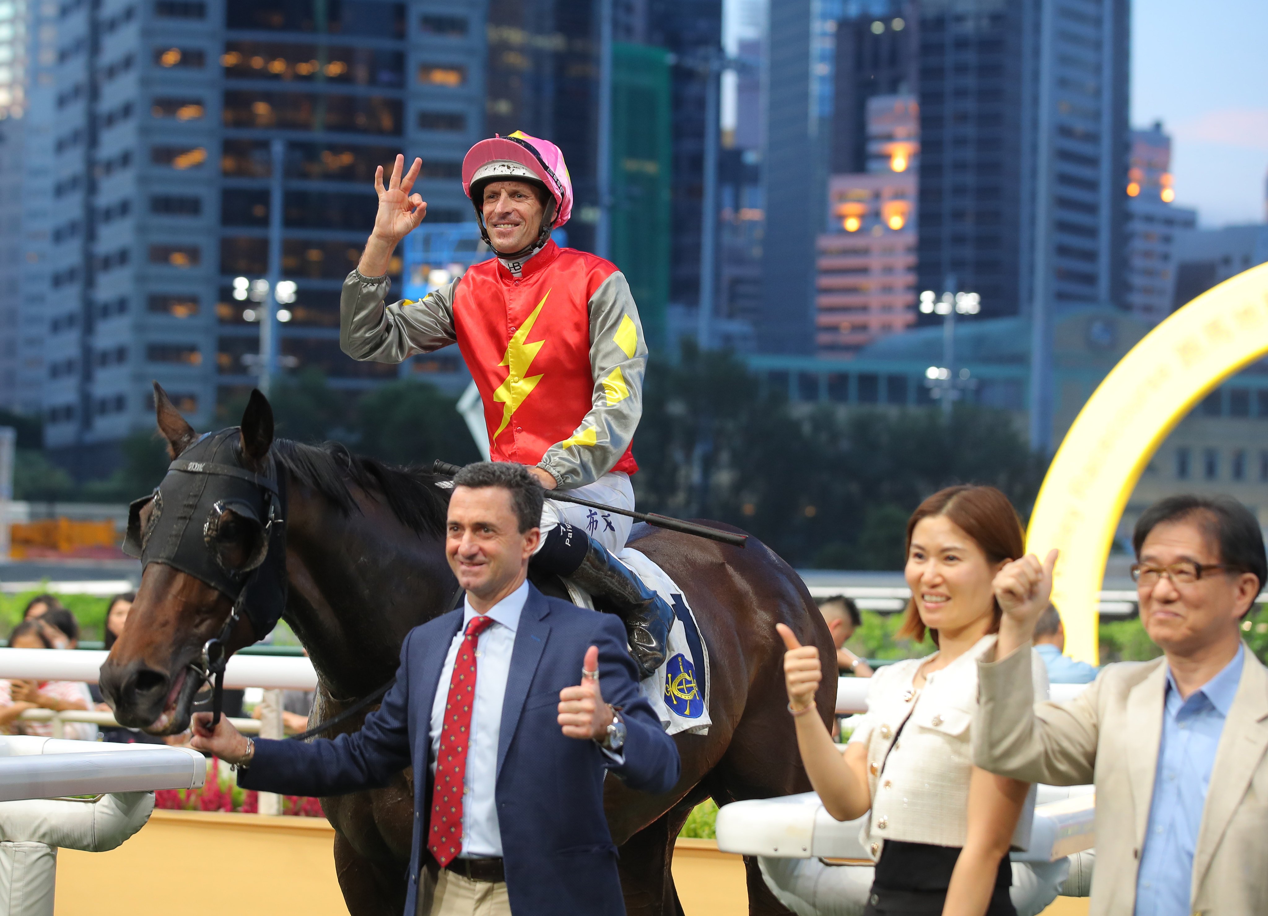 Hugh Bowman, Douglas Whyte and connections celebrate Majestic Knight’s Happy Valley win. Photos: Kenneth Chan