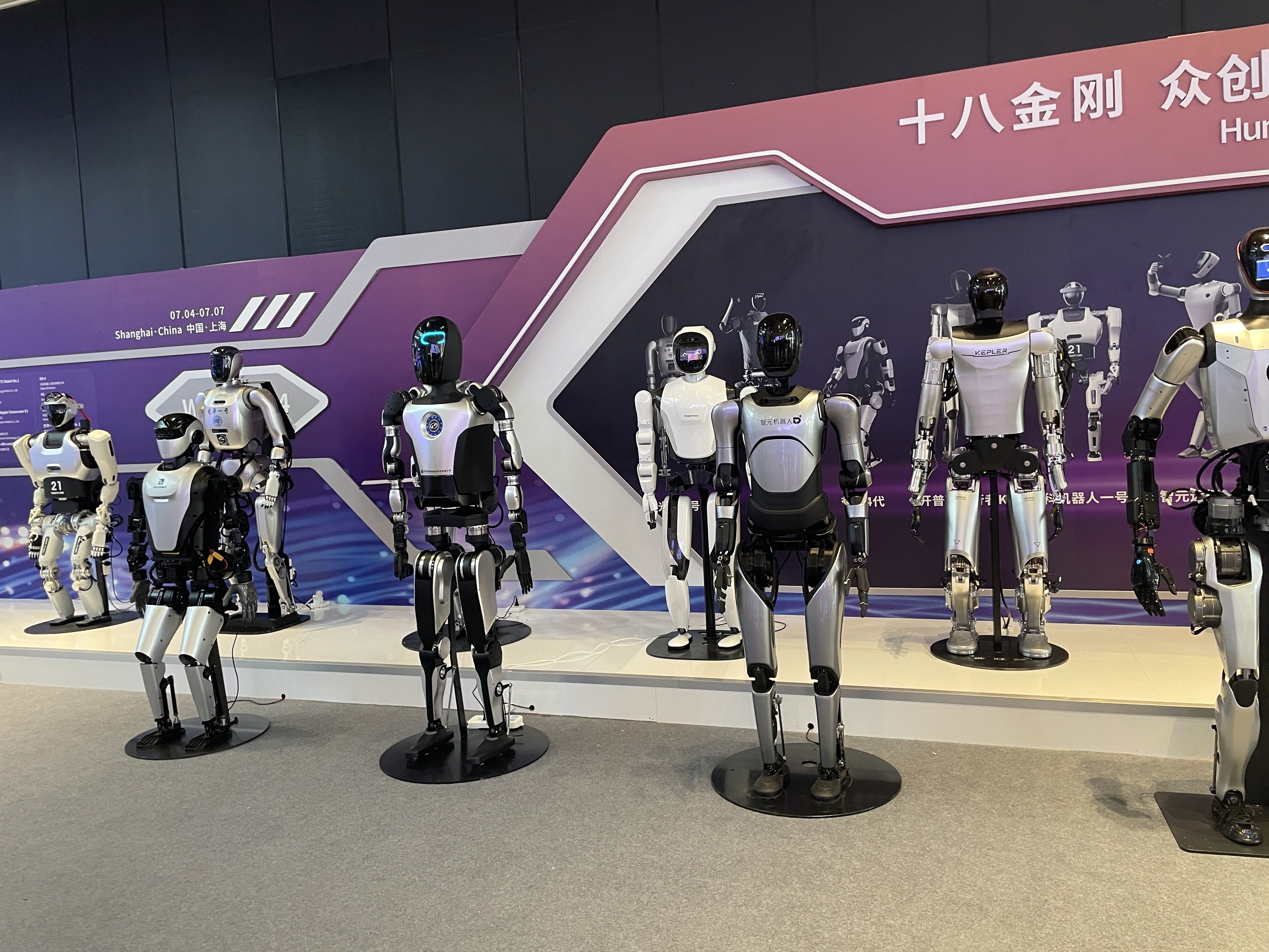 Eighteen humanoid robots from various brands on display during the 2024 World Artificial Intelligence Conference in Shanghai on Thursday. Photo: Che Pan