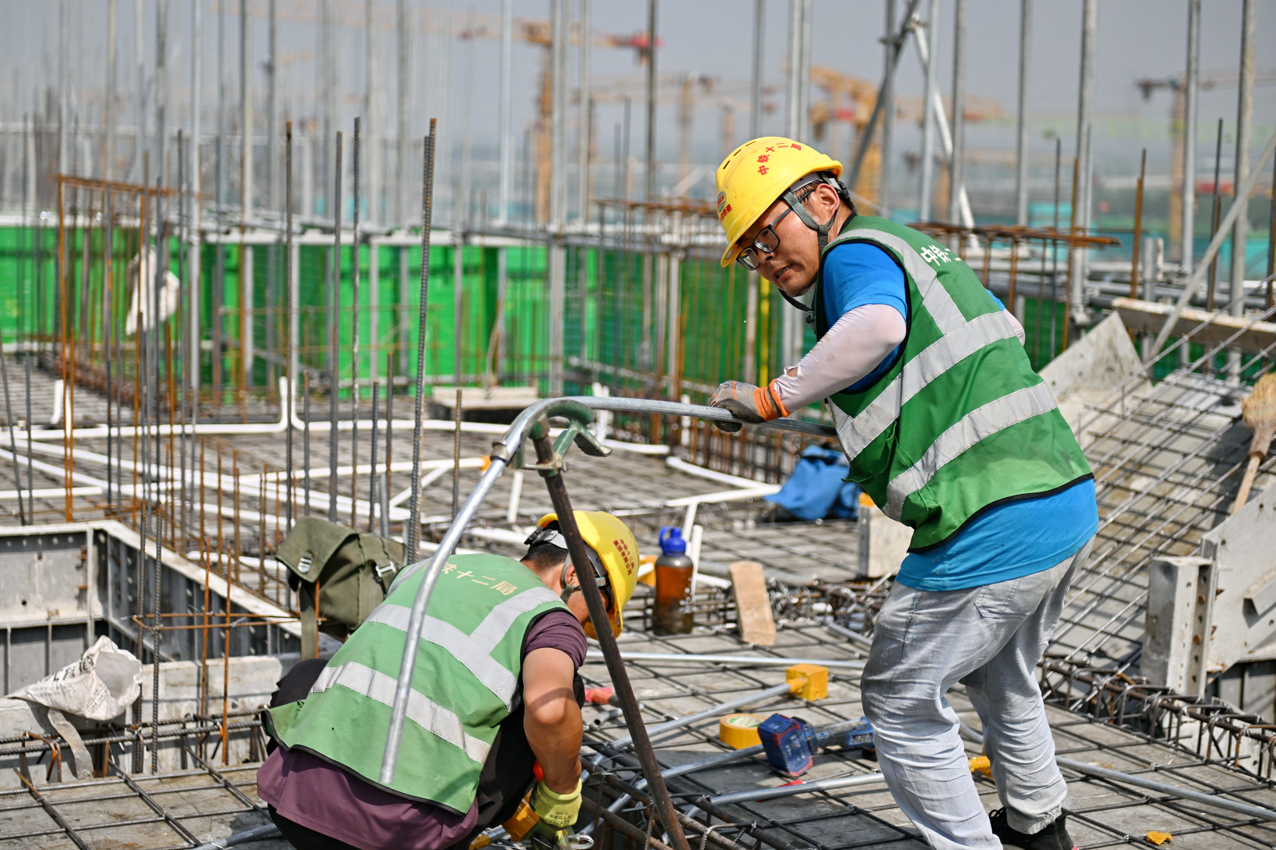 The State Council action plan mandated the use of green building materials in government construction projects, including hospitals, schools, office buildings, exhibition halls and subsidised housing. Photo: Xinhua