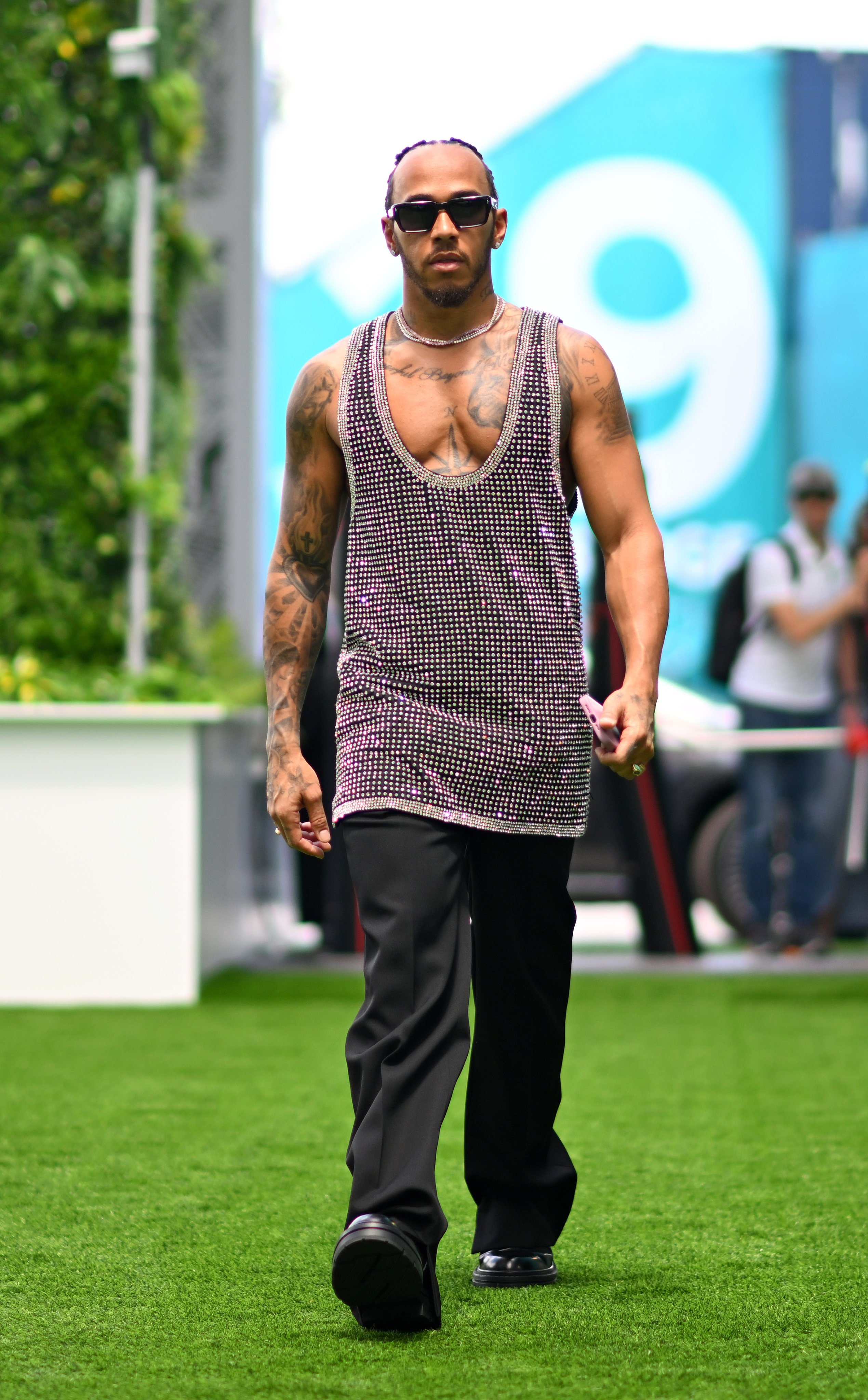 Formula One’s Lewis Hamilton of Great Britain and Mercedes is one of the all-time great drivers, but he also turns heads with his equally confident fashion moves too. Photo: Getty Images