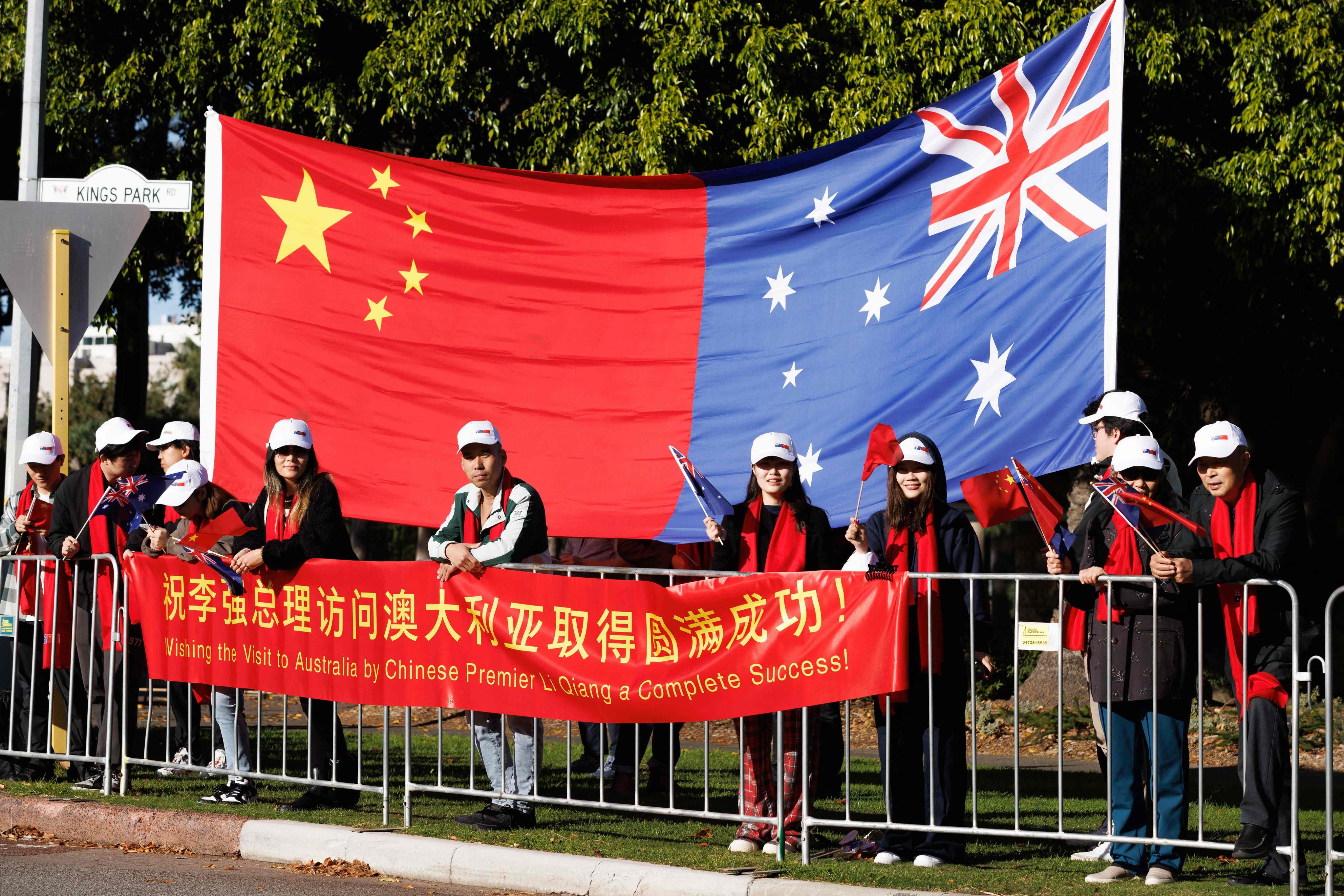 Members of the Australian-Chinese community await the arrival of China’s Premier Li Qiang and Australian Prime Minister Anthony Albanese in Perth last month. Photo: AFP