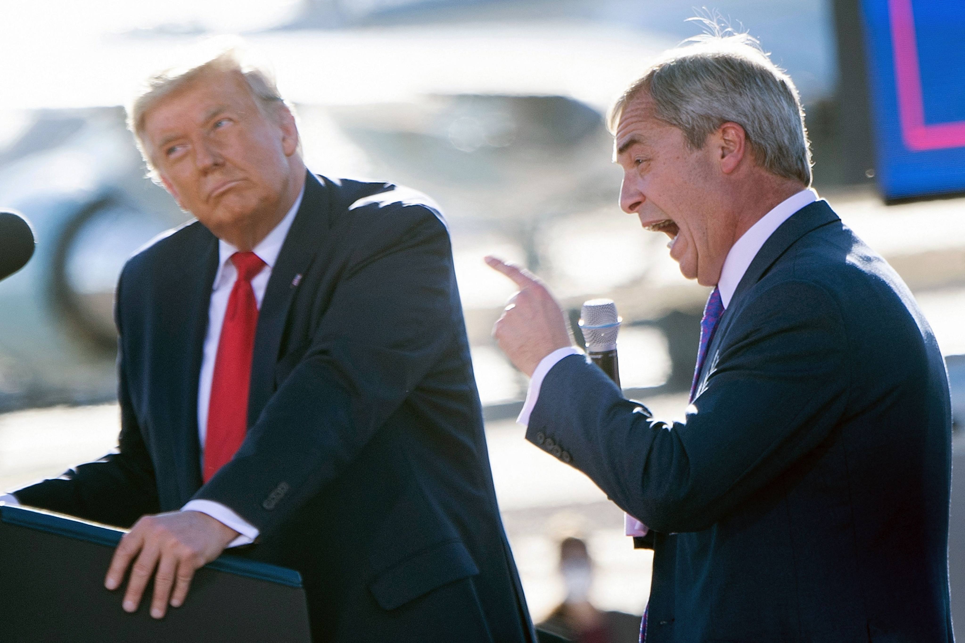Then US President Donald Trump listens as UK politician Nigel Farage speaks during a Make America Great Again rally in Goodyear, Arizona, in October 2020. Photo: AFP