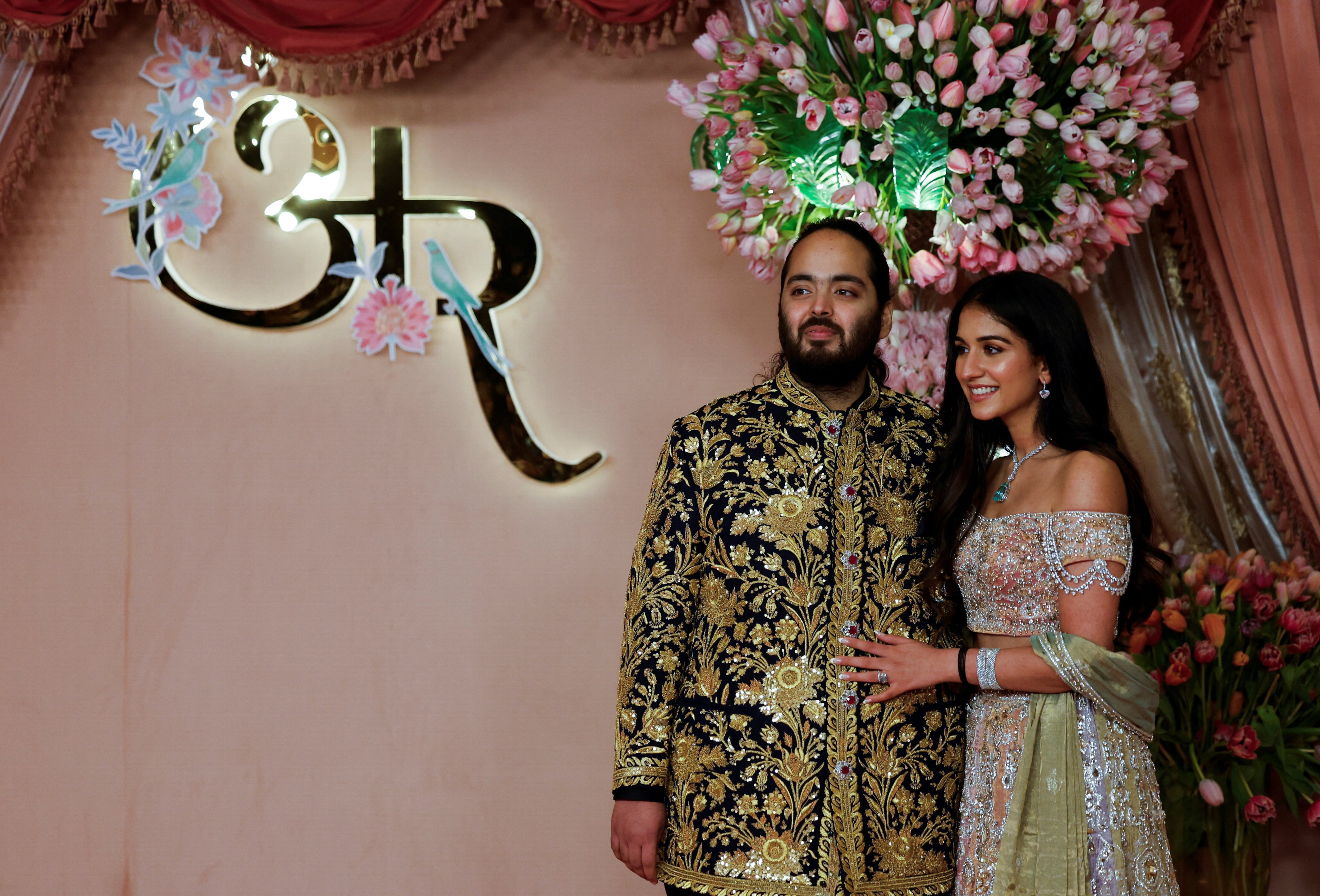 Anant Ambani with his fiancée Radhika Merchant during a ceremony in Mumbai on July 5. Photo: Reuters