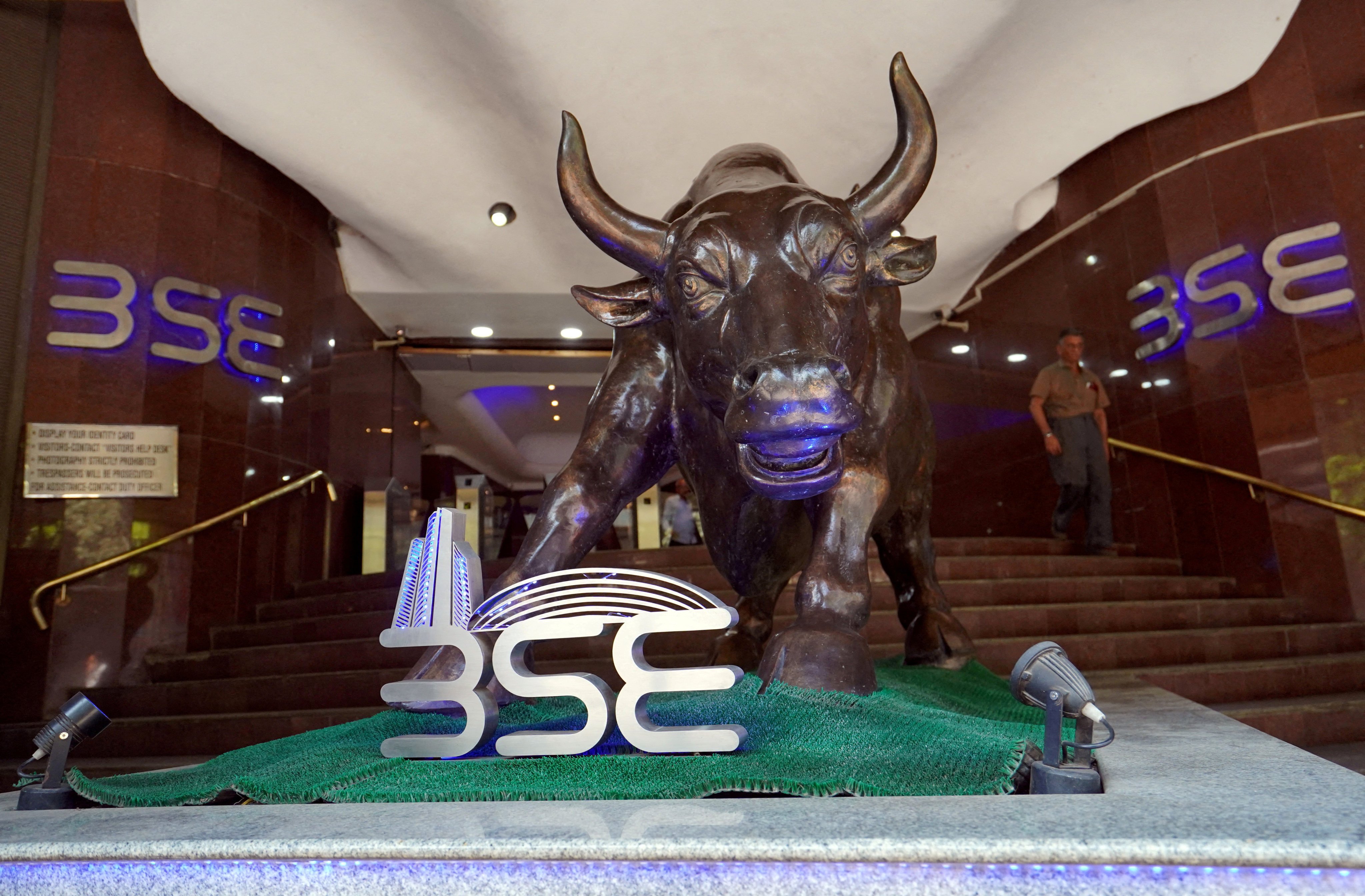 FILE PHOTO: FILE PHOTO: A man walks out of the Bombay Stock Exchange (BSE) building in Mumbai, India, February 28, 2020. REUTERS/Hemanshi Kamani/File Photo/File Photo/File Photo