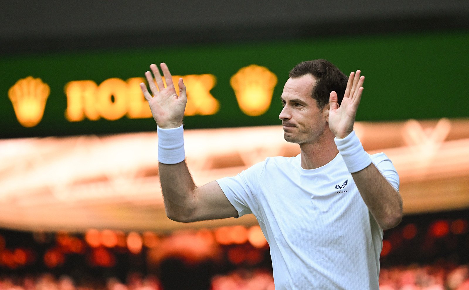 Andy Murray waves to the crowd on Centre Court at Wimbledon. Photo: TNS