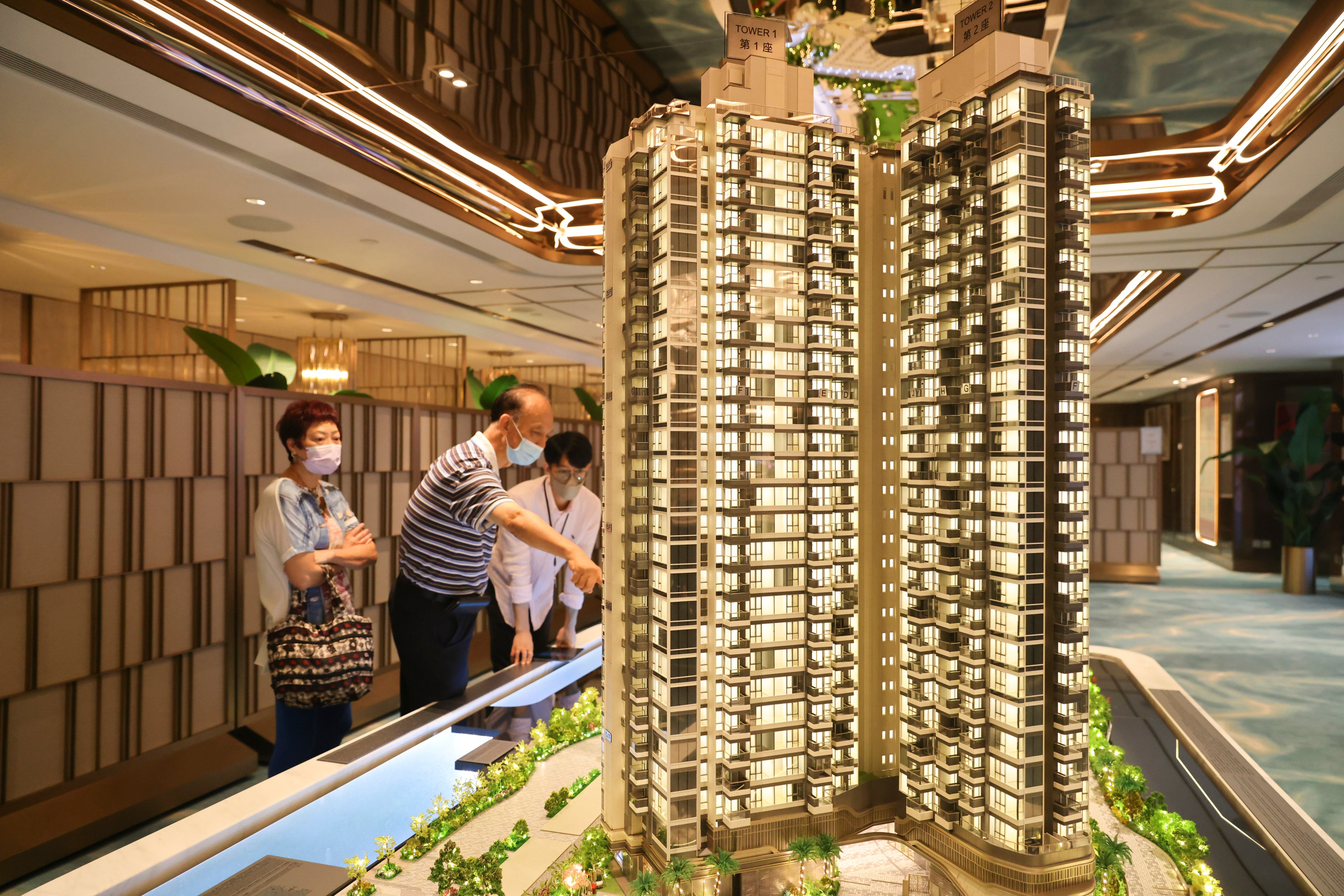 Potential buyers looked at a model of Miami Quay at the developers’ sales room at The Gateway in Tsim Sha Tsui on 18 September 2022. Photo: Dickson Lee