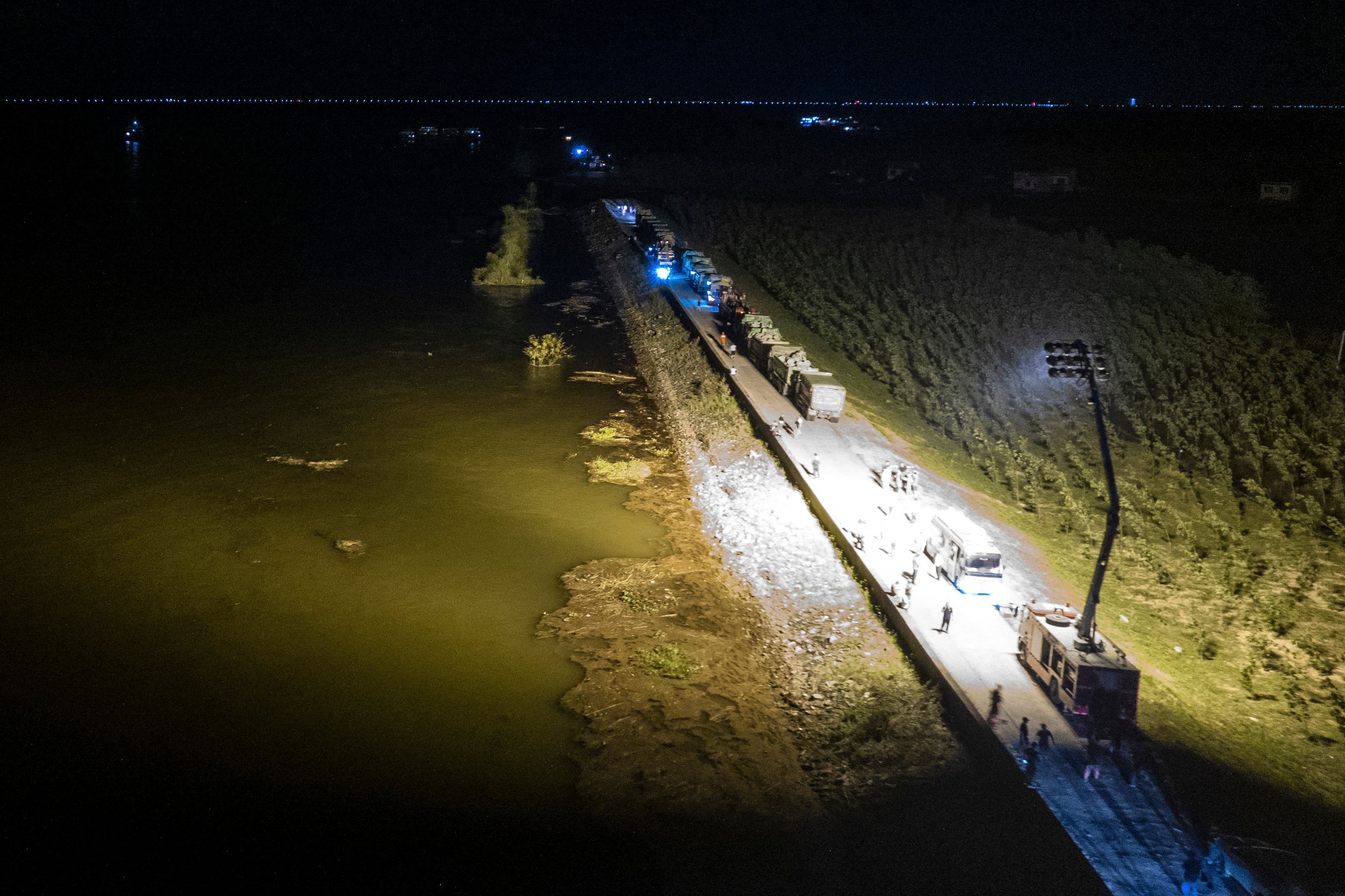 Rescuers work to block the affected dyke along Dongting Lake, in Huarong county in China’s central province of  Hunan. Photo: Xinhua