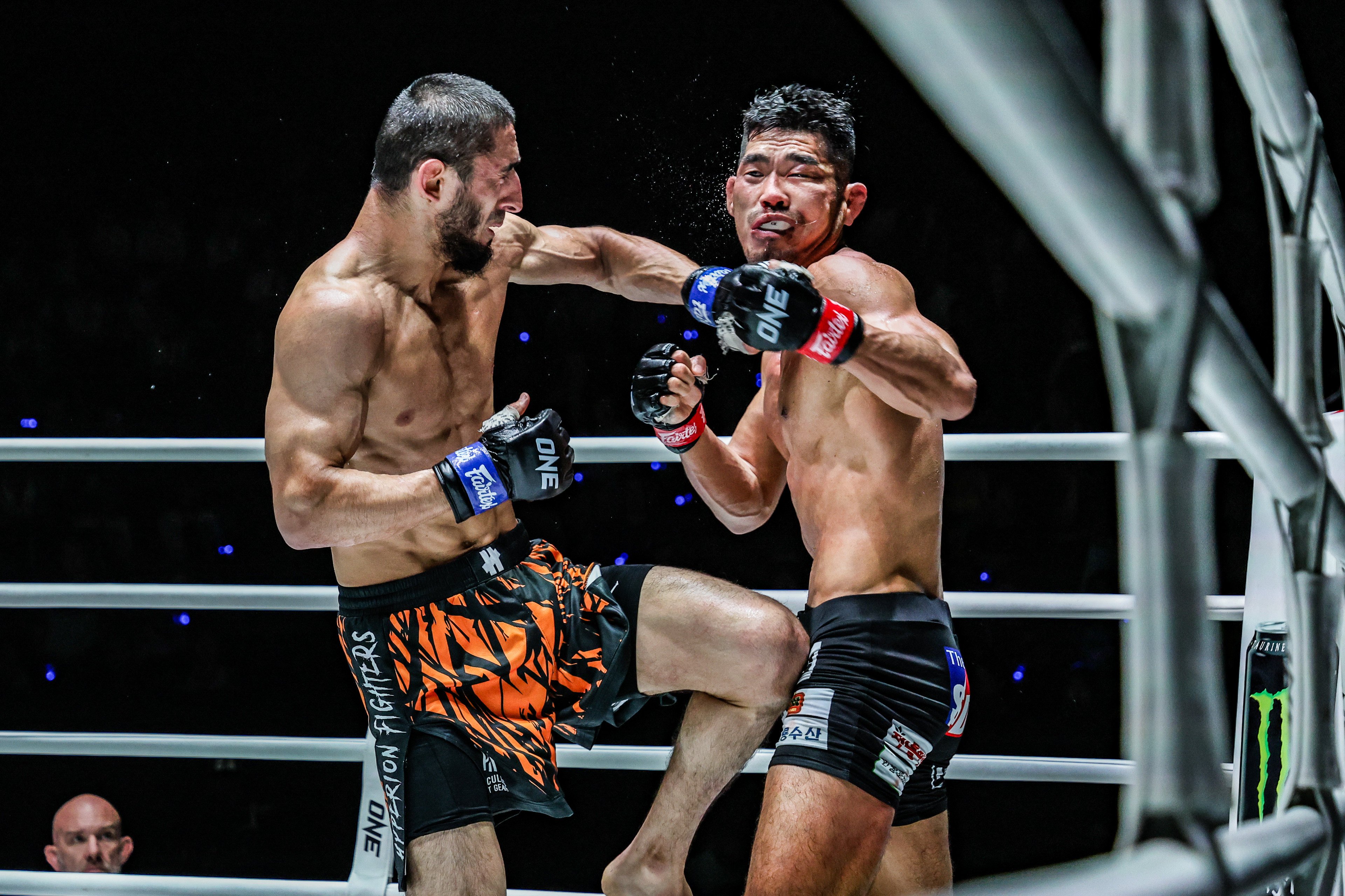 Alibeg Rasulov connects with a left on Ok Rae-yoon during their lightweight MMA bout at ONE Fight Night 23 in Bangkok. Photo: ONE Championship