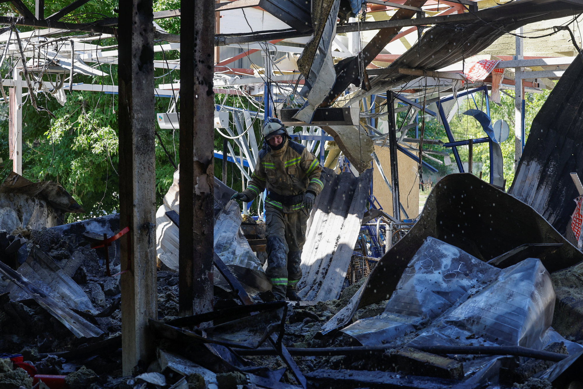 A firefighter walks through debris of a supermarket destroyed by recent shelling in Donetsk, Russian-controlled Ukraine, on July 3. Photo: Reuters